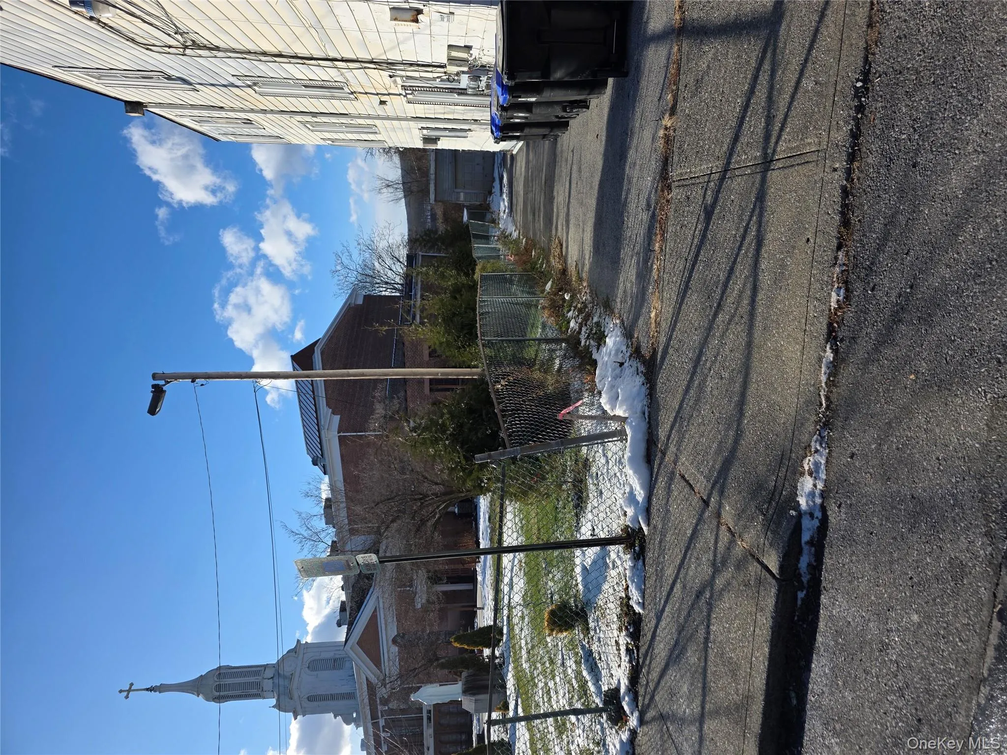 View of asphalt road with street lights View of asphalt road with street lights