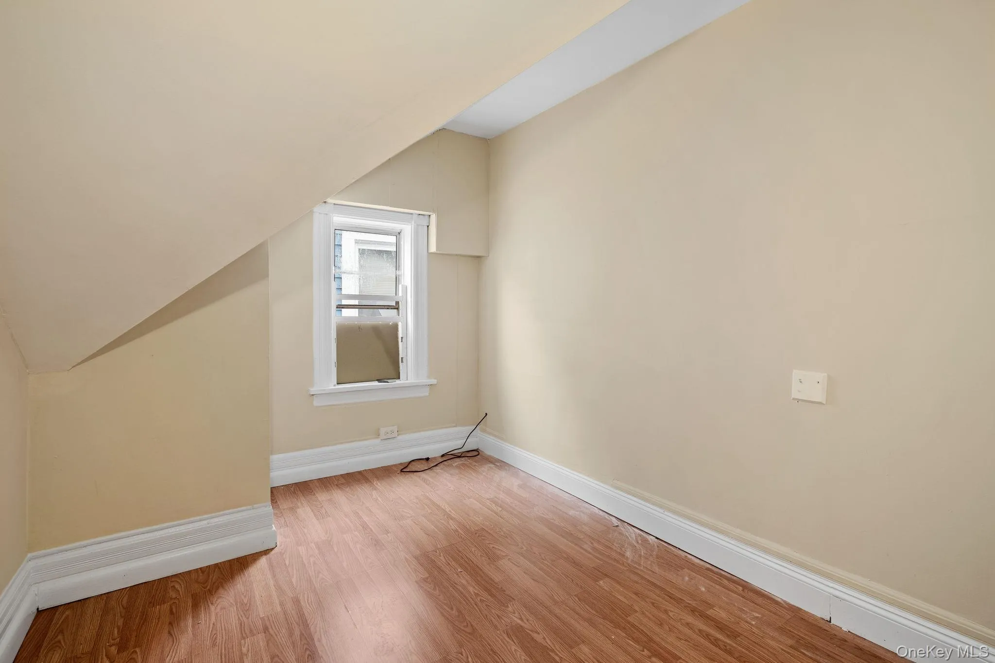 Additional living space with baseboards and light wood finished floors Additional living space with baseboards and light wood finished floors