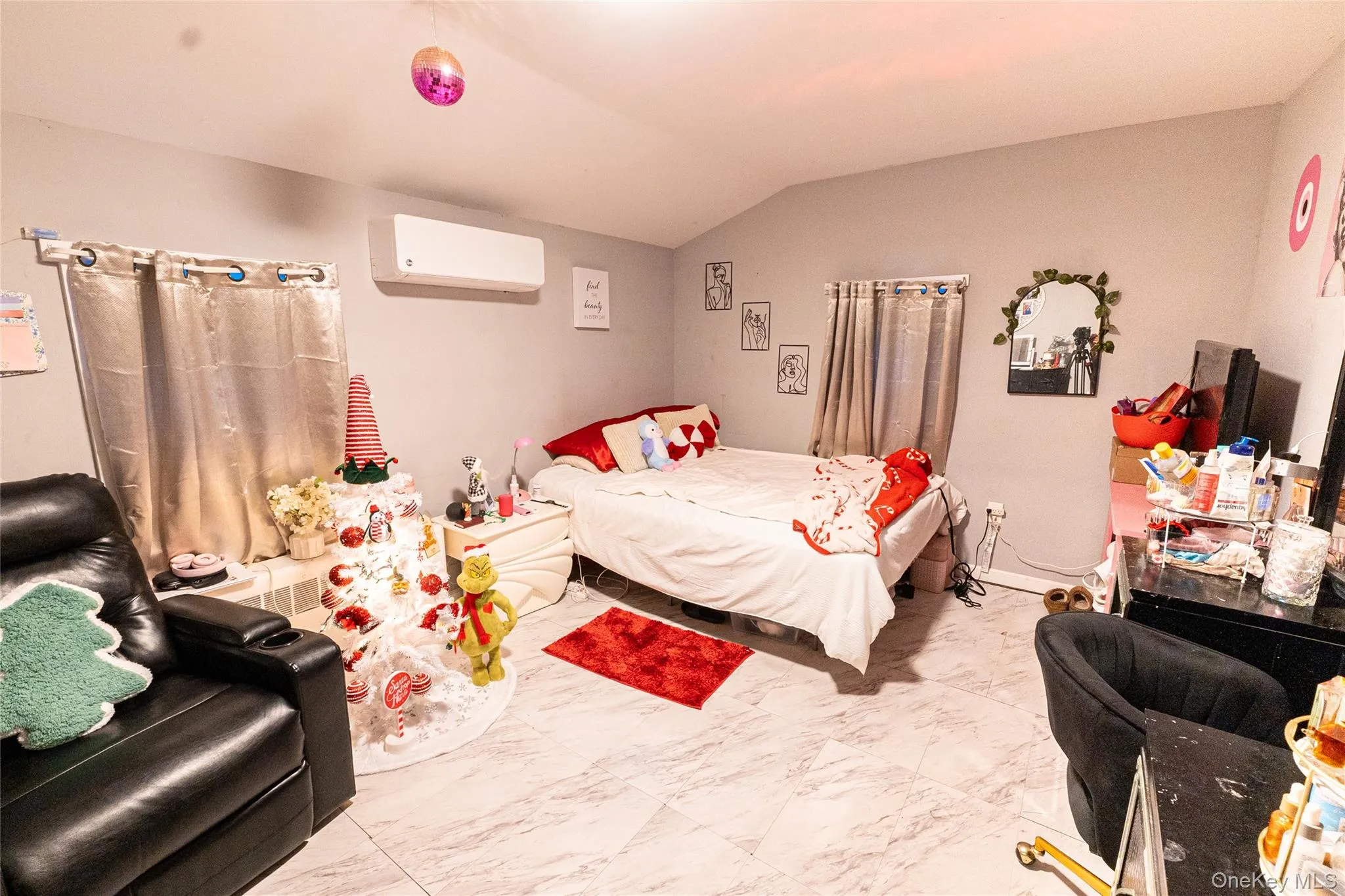 Bedroom featuring vaulted ceiling and marble finish flooring Bedroom featuring vaulted ceiling and marble finish flooring