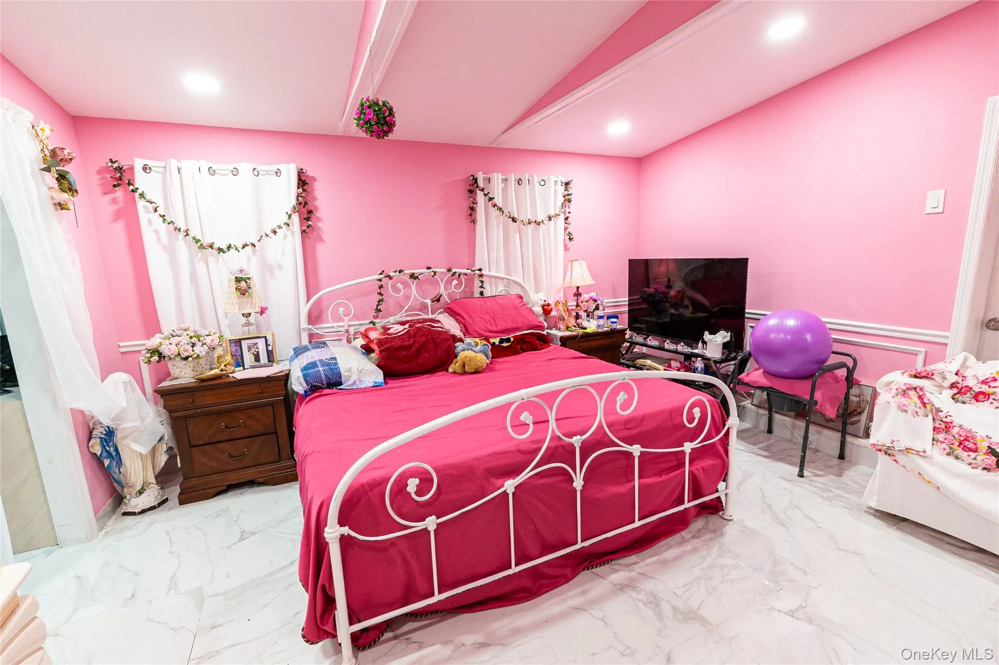 Bedroom featuring marble finish flooring and recessed lighting Bedroom featuring marble finish flooring and recessed lighting