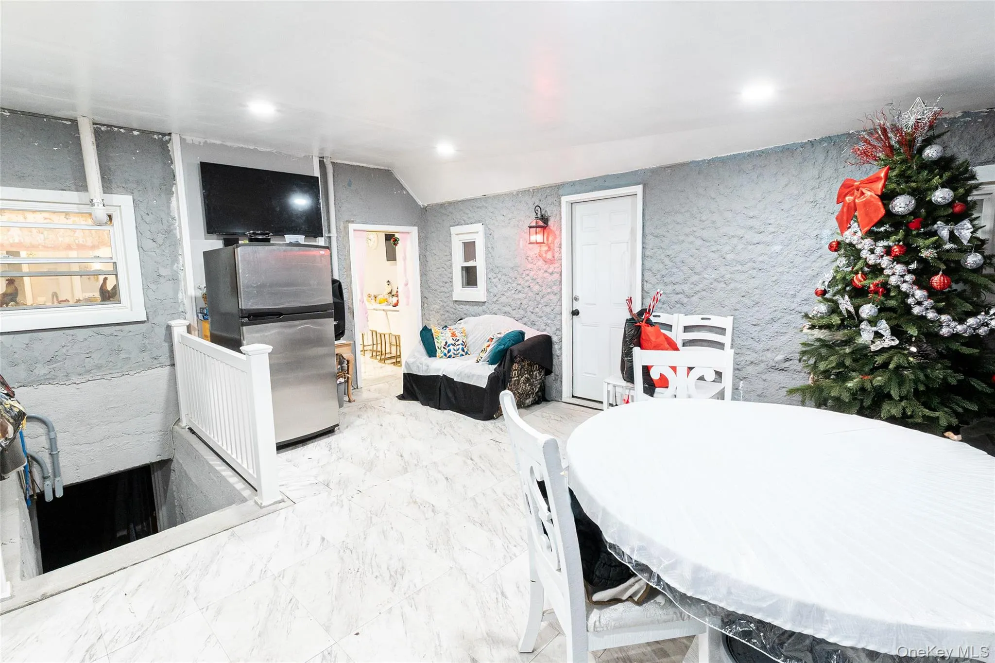 Dining area featuring recessed lighting and light marble finish floors Dining area featuring recessed lighting and light marble finish floors