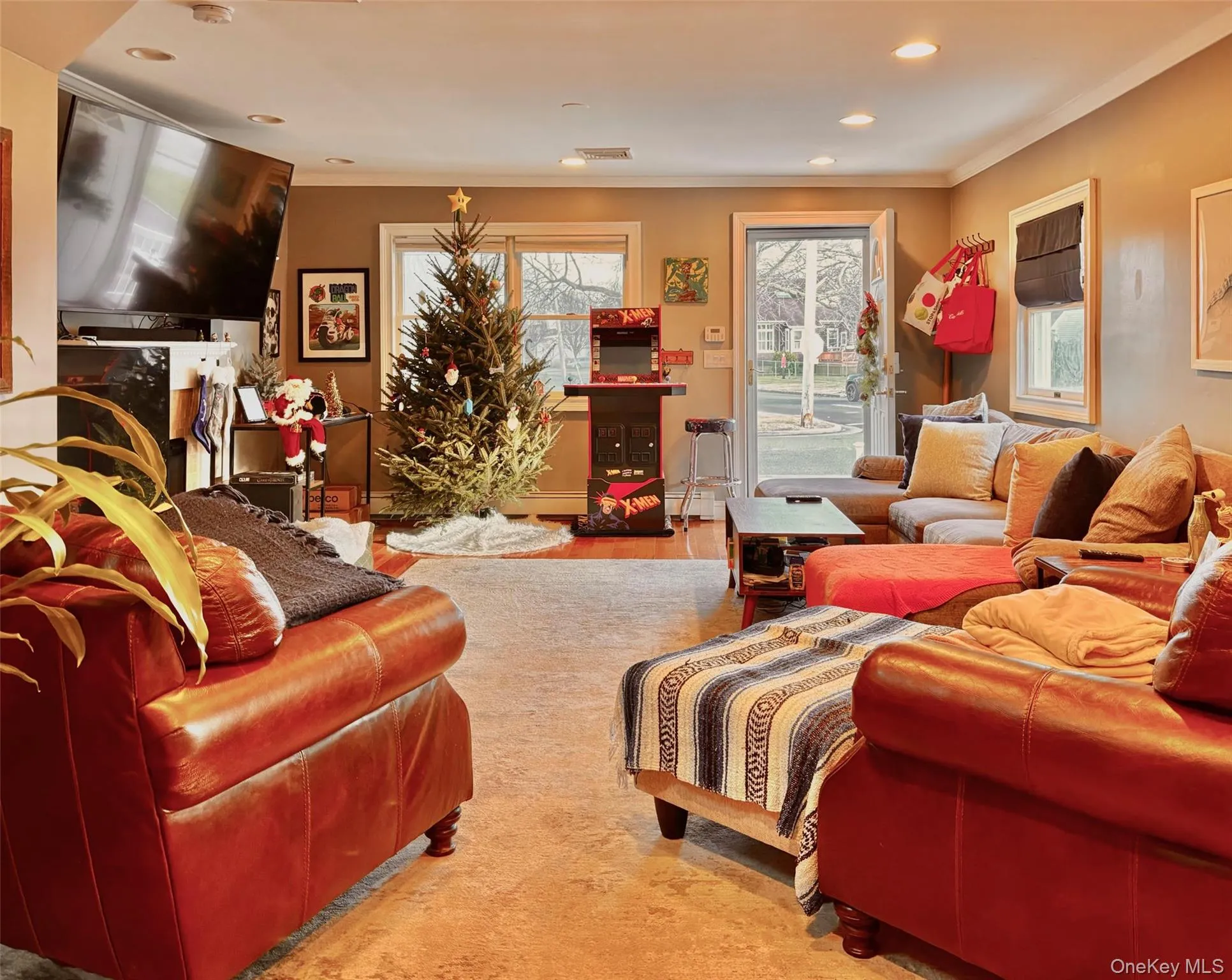 Living room featuring crown molding and recessed lighting Living room featuring crown molding and recessed lighting