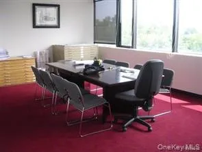 Dining area featuring dark carpet Dining area featuring dark carpet