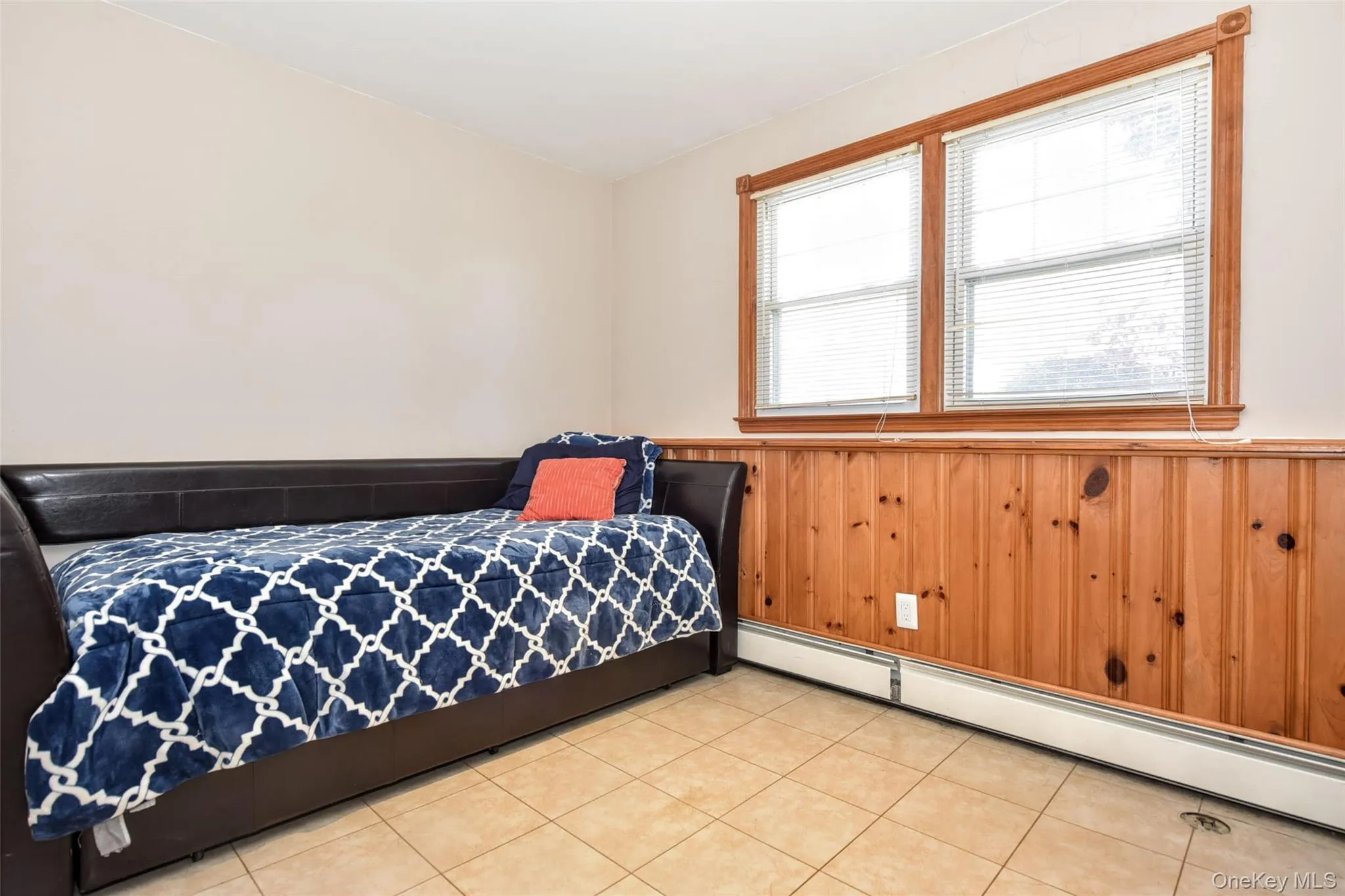 This versatile room can be used as an office, den, playroom etc. features natural wood paneling, two windows with blinds, and baseboard heating This versatile room can be used as an office, den, playroom etc. features natural wood paneling, two windows with blinds, and baseboard heating