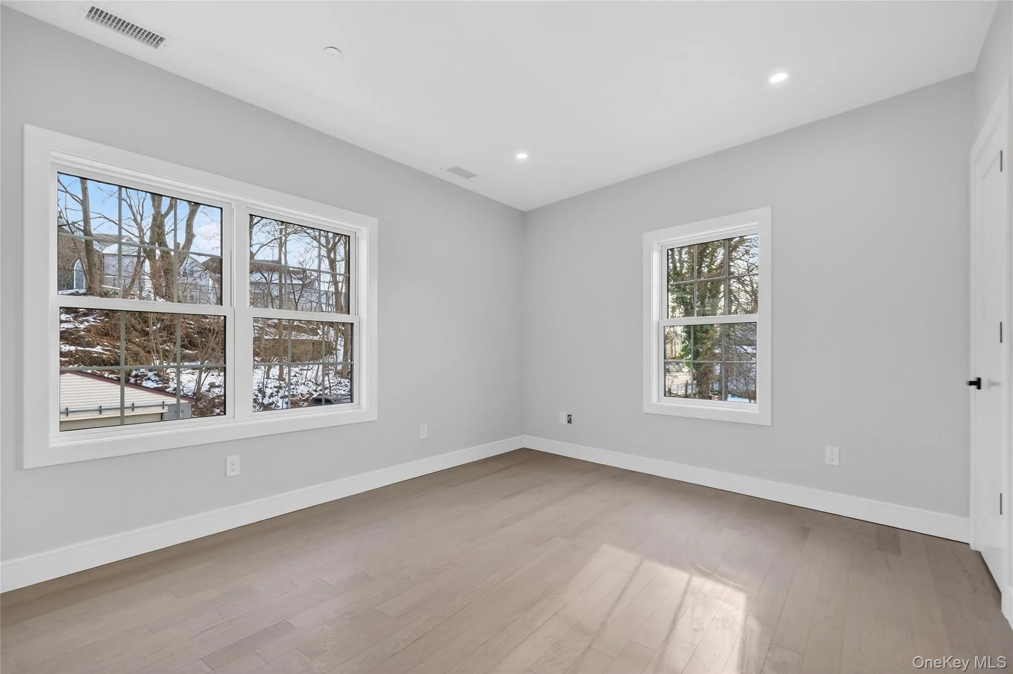 Spare room featuring light wood-style flooring and recessed lighting Spare room featuring light wood-style flooring and recessed lighting