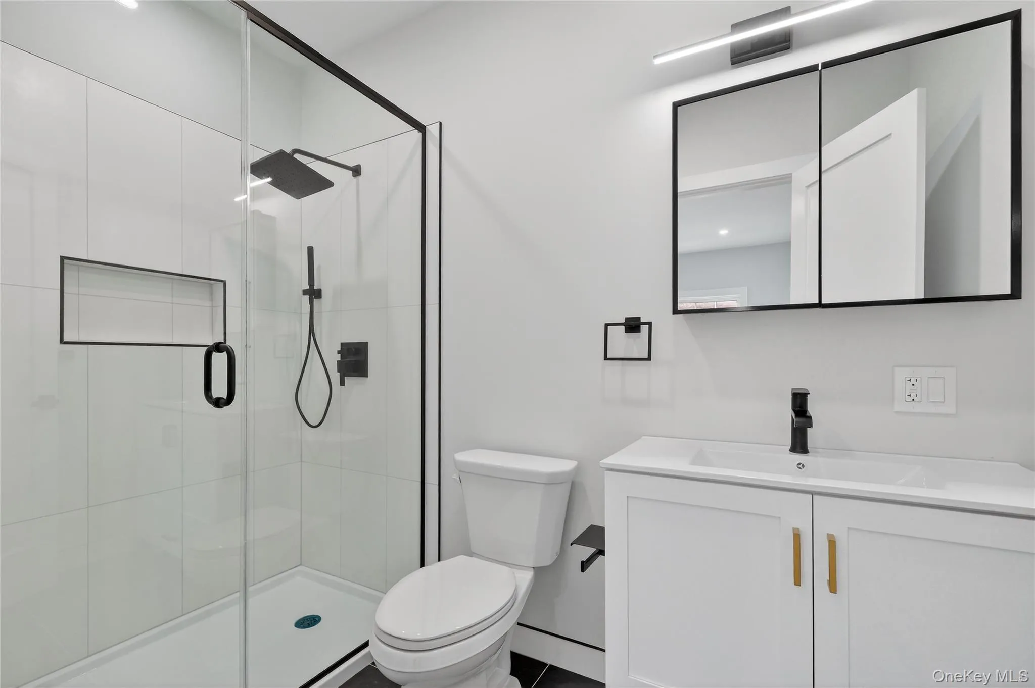 Full bathroom with vanity and a shower stall Full bathroom with vanity and a shower stall