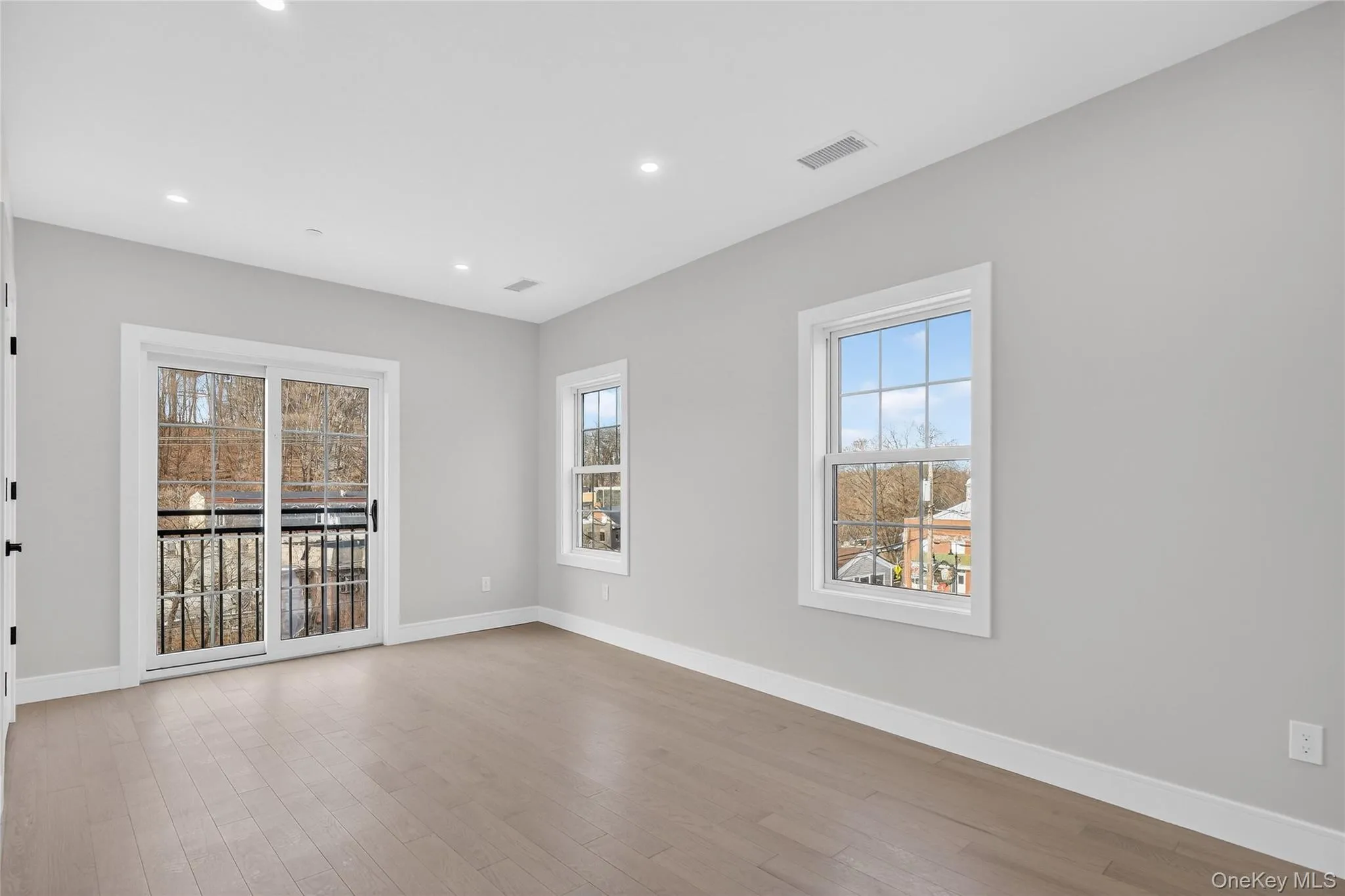 Empty room featuring light wood-style floors and recessed lighting Empty room featuring light wood-style floors and recessed lighting