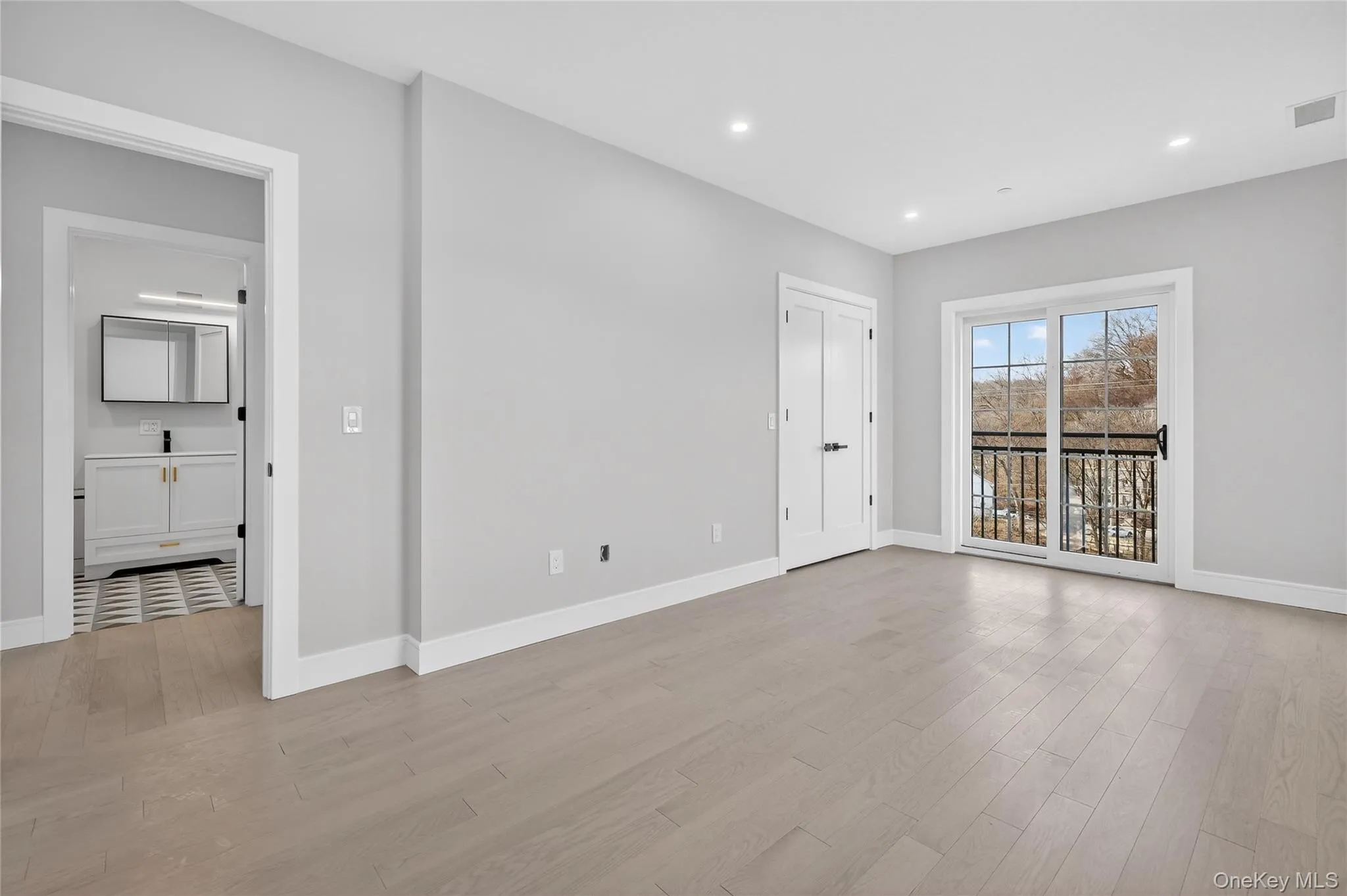 Spare room featuring light wood-type flooring and recessed lighting Spare room featuring light wood-type flooring and recessed lighting