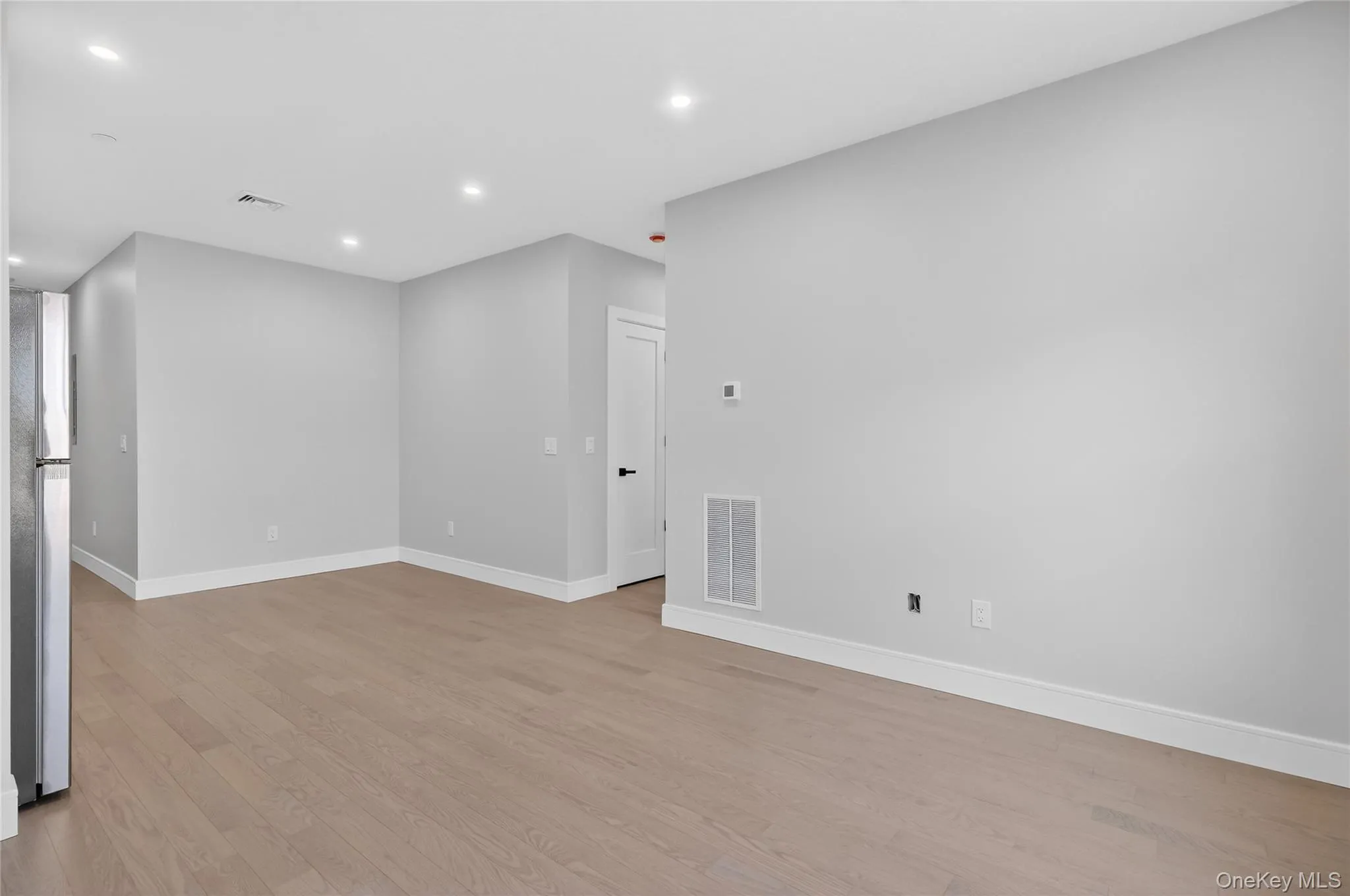Spare room featuring recessed lighting and light wood-style flooring Spare room featuring recessed lighting and light wood-style flooring