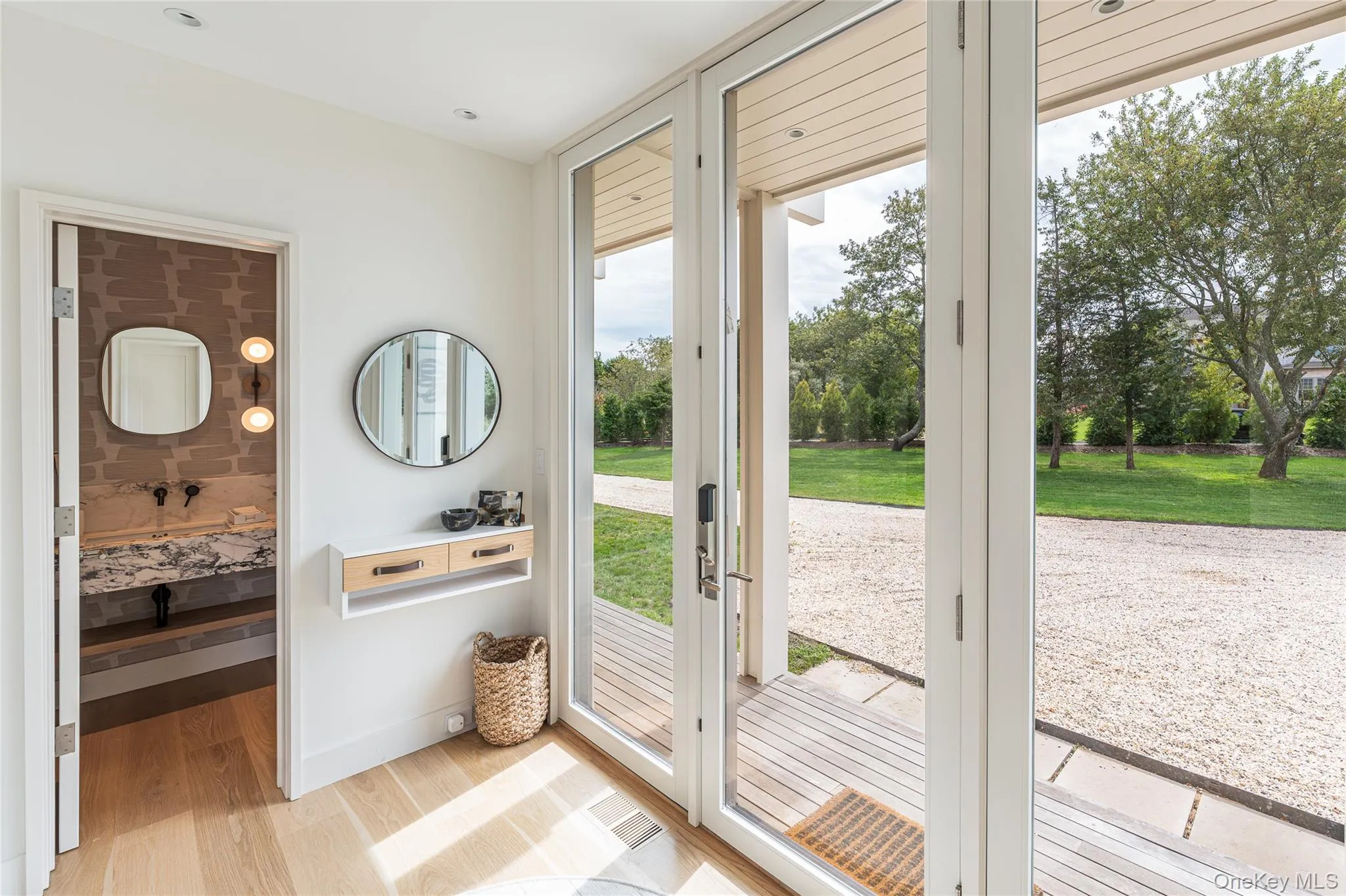 Doorway featuring wood finished floors and baseboards Doorway featuring wood finished floors and baseboards