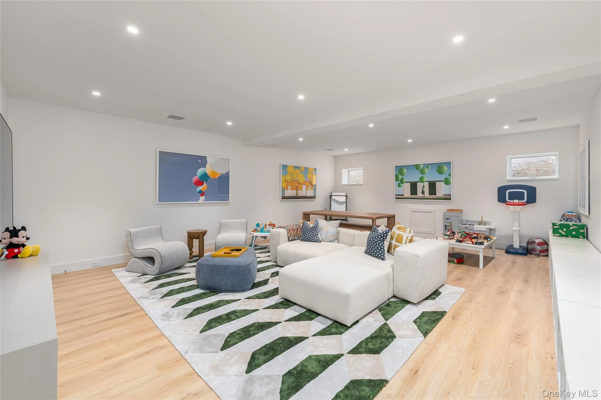 Living room featuring recessed lighting and light wood-style flooring Living room featuring recessed lighting and light wood-style flooring