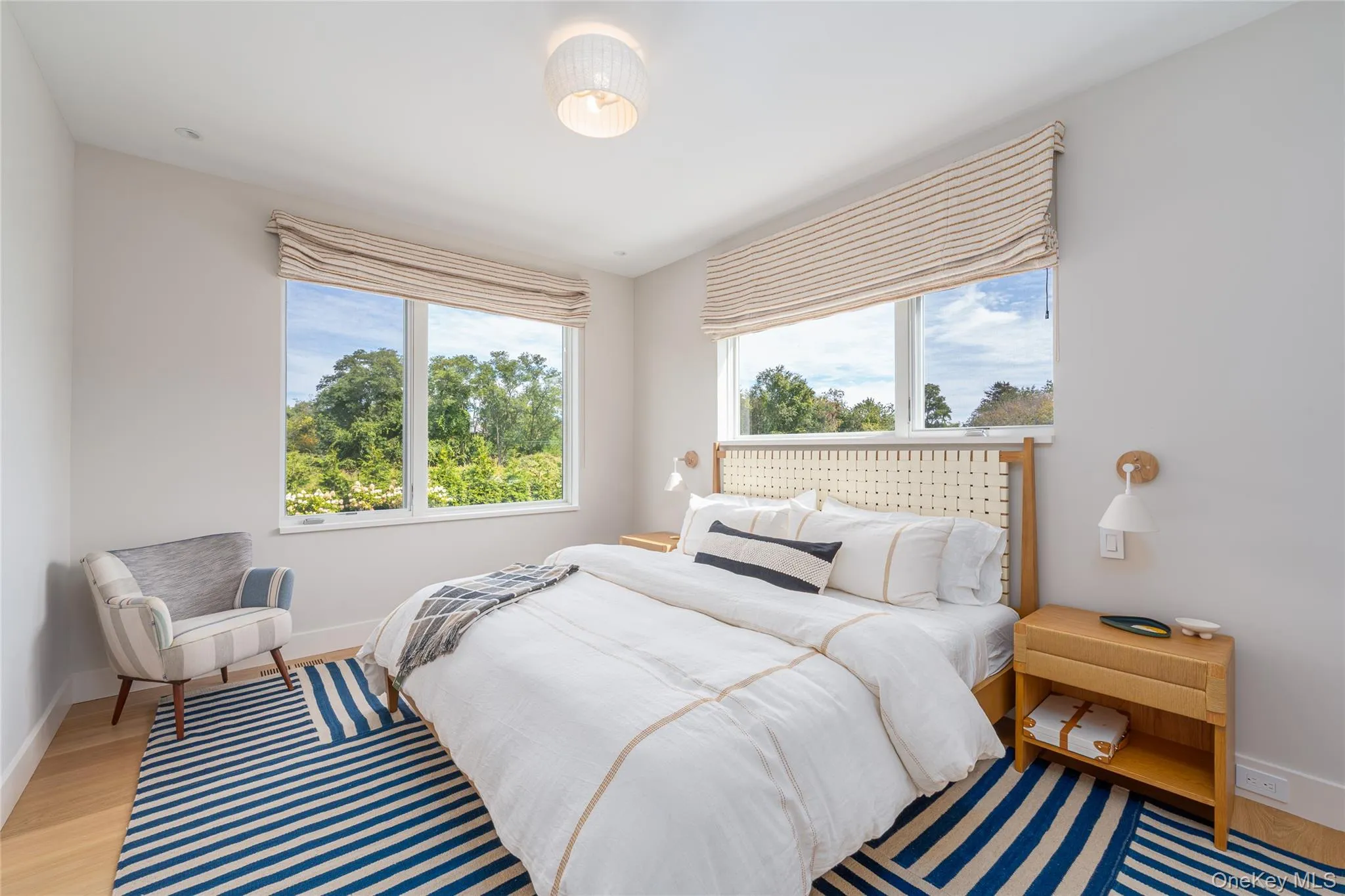 Bedroom with baseboards and wood finished floors Bedroom with baseboards and wood finished floors