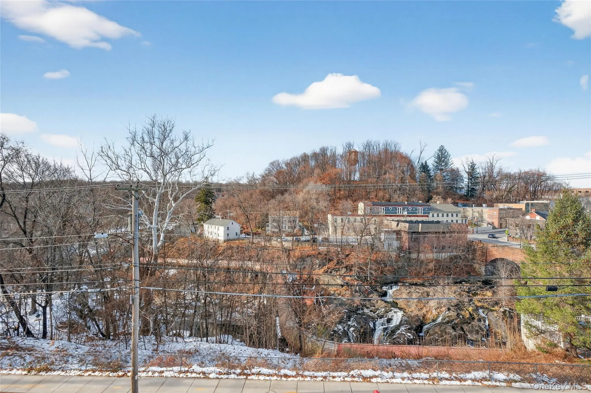 View of yard layered in snow View of yard layered in snow