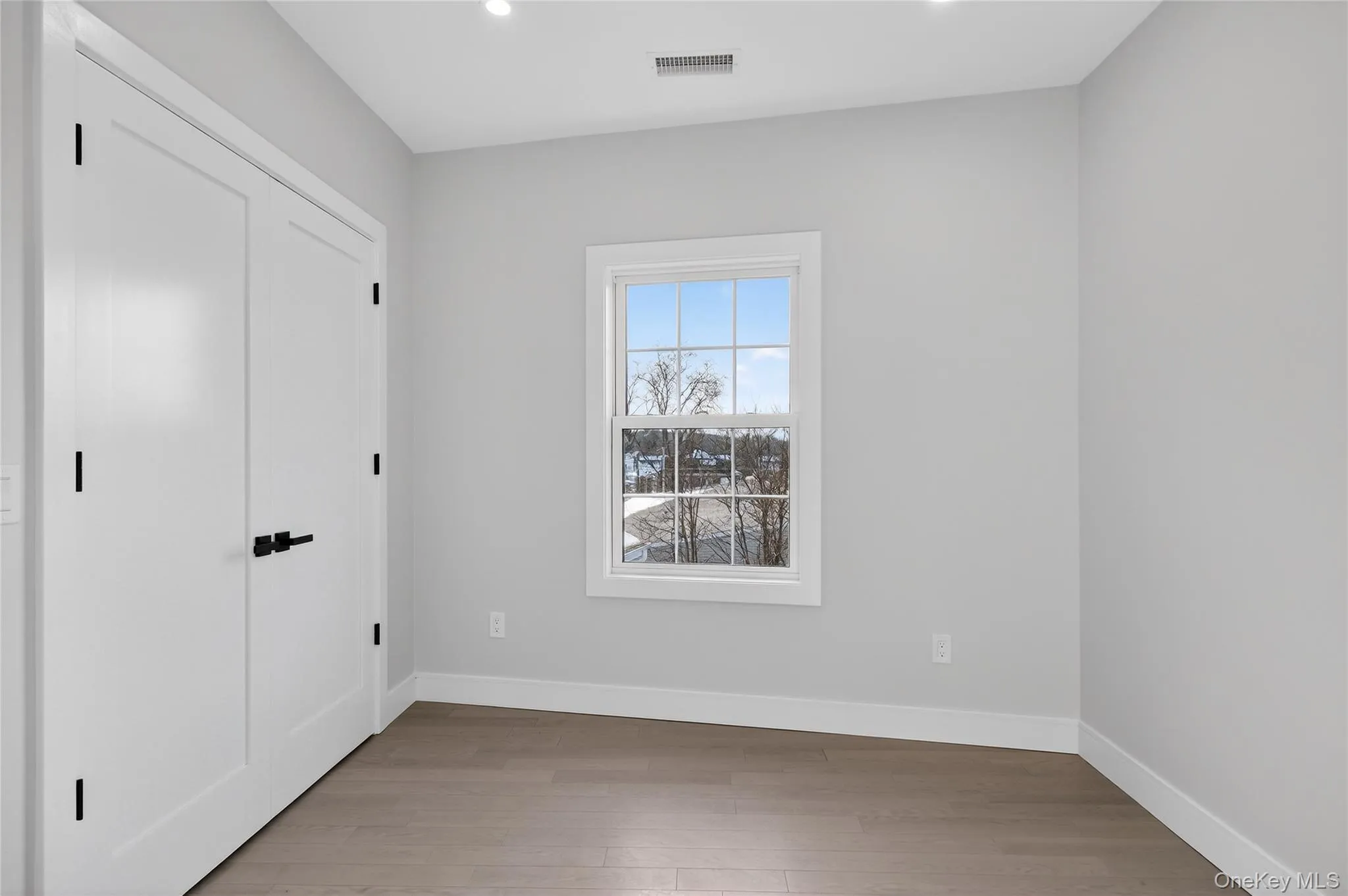 Unfurnished bedroom featuring a closet, light wood-type flooring, and recessed lighting Unfurnished bedroom featuring a closet, light wood-type flooring, and recessed lighting