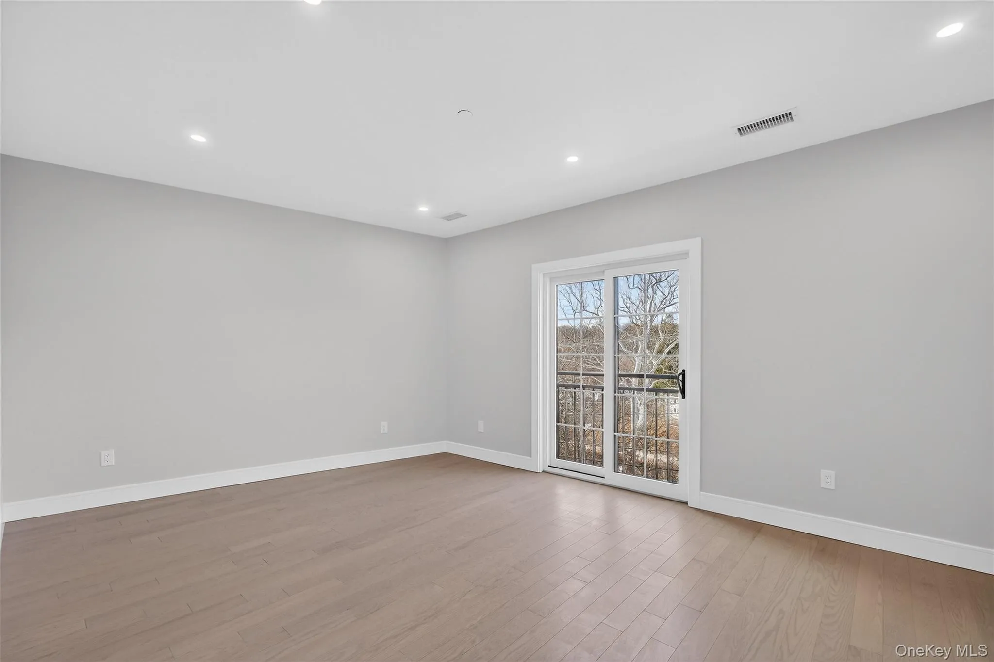 Unfurnished room featuring light wood-type flooring and recessed lighting Unfurnished room featuring light wood-type flooring and recessed lighting