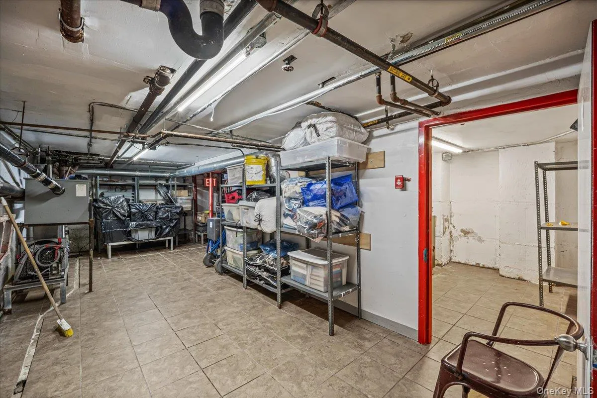 Unfinished below grade area featuring light tile patterned floors Unfinished below grade area featuring light tile patterned floors