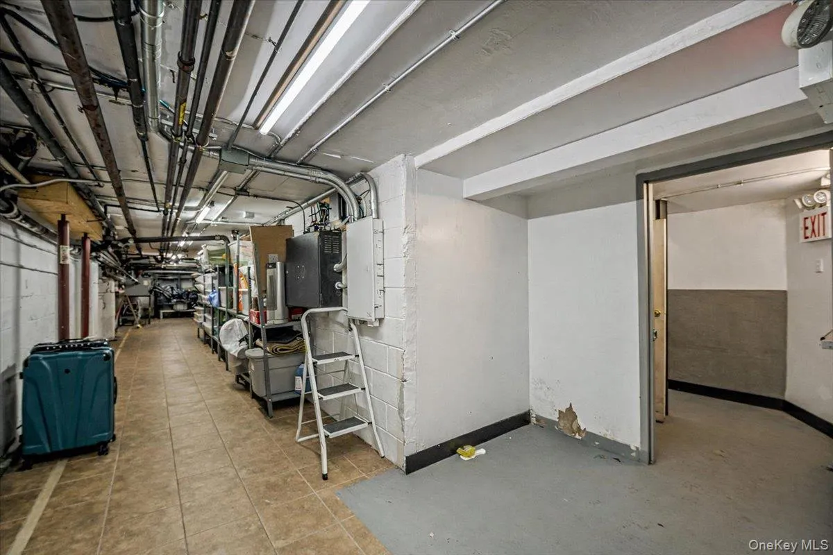 Below grade area with concrete block wall and baseboards Below grade area with concrete block wall and baseboards