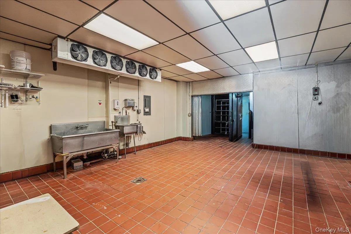 Miscellaneous room with a paneled ceiling and electric panel Miscellaneous room with a paneled ceiling and electric panel