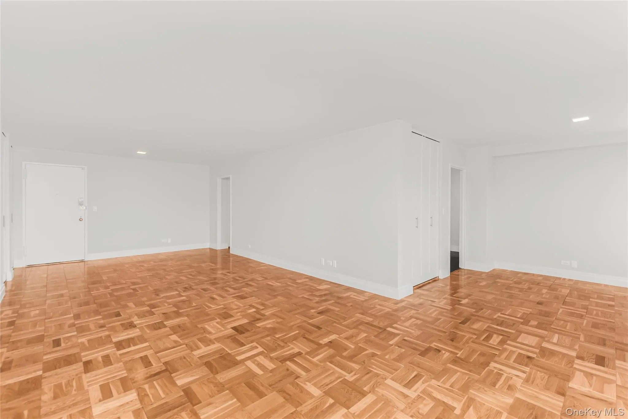 Living room/dining area featuring baseboards Living room/dining area featuring baseboards
