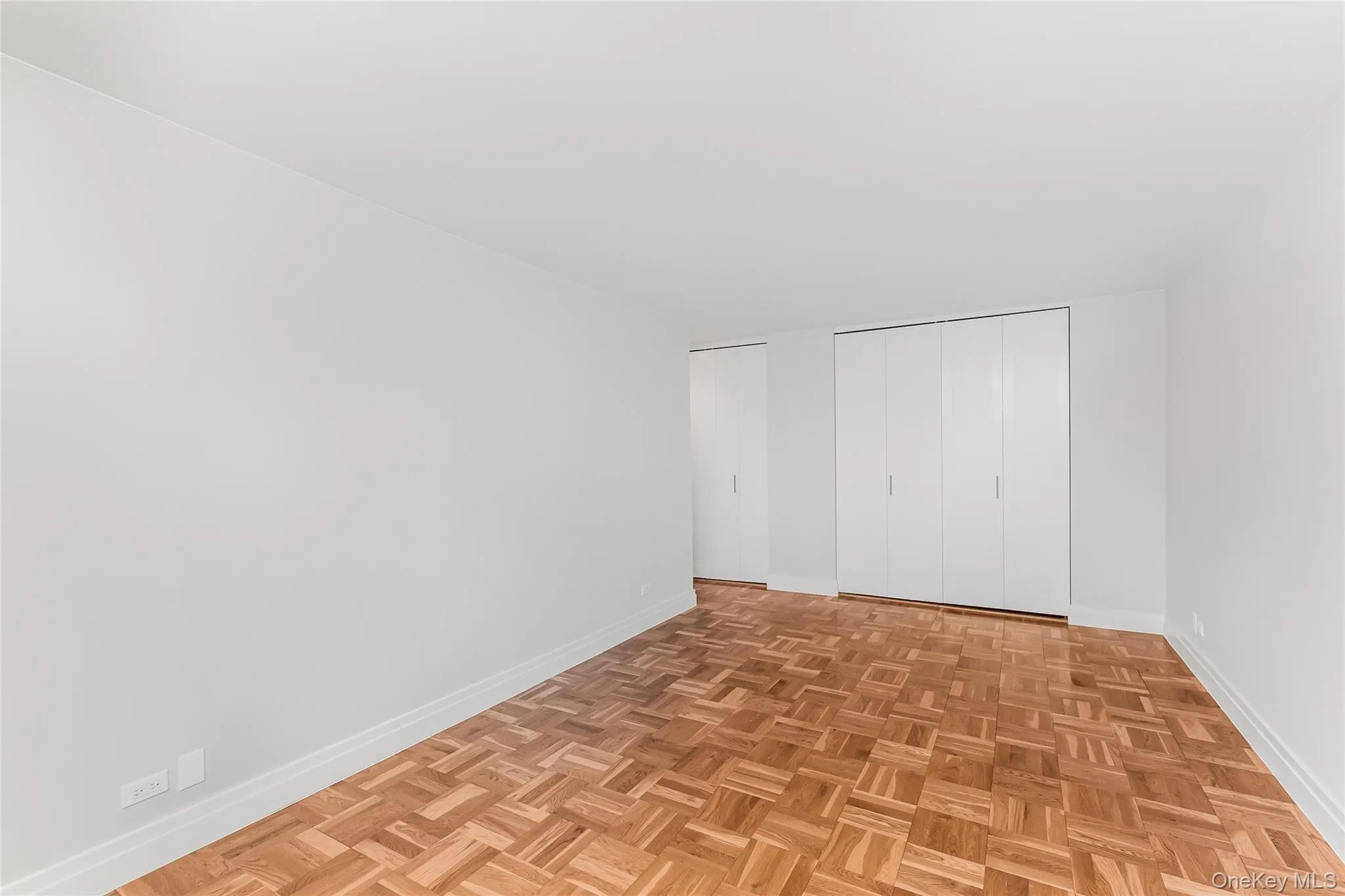 Unfurnished bedroom featuring baseboards and a closet Unfurnished bedroom featuring baseboards and a closet