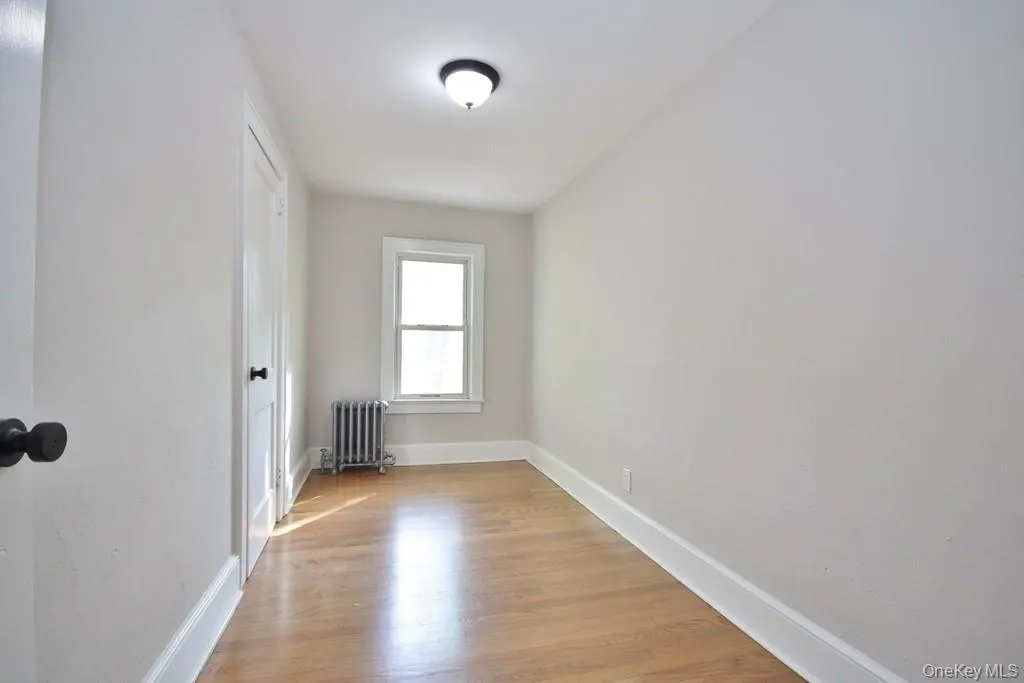 Third Bedroom has hardwood floors and a closet Third Bedroom has hardwood floors and a closet