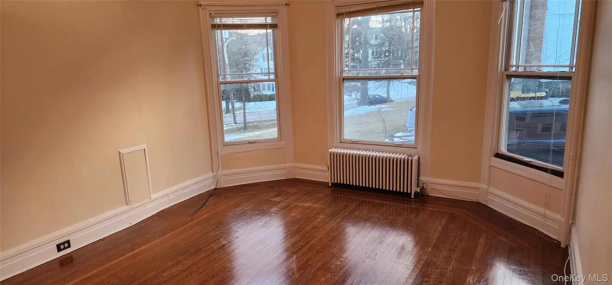 Living Room with radiator and dark wood-style floors Living Room with radiator and dark wood-style floors