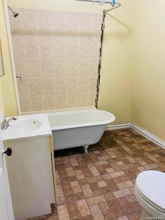 Bathroom featuring vanity and toilet Bathroom featuring vanity and toilet