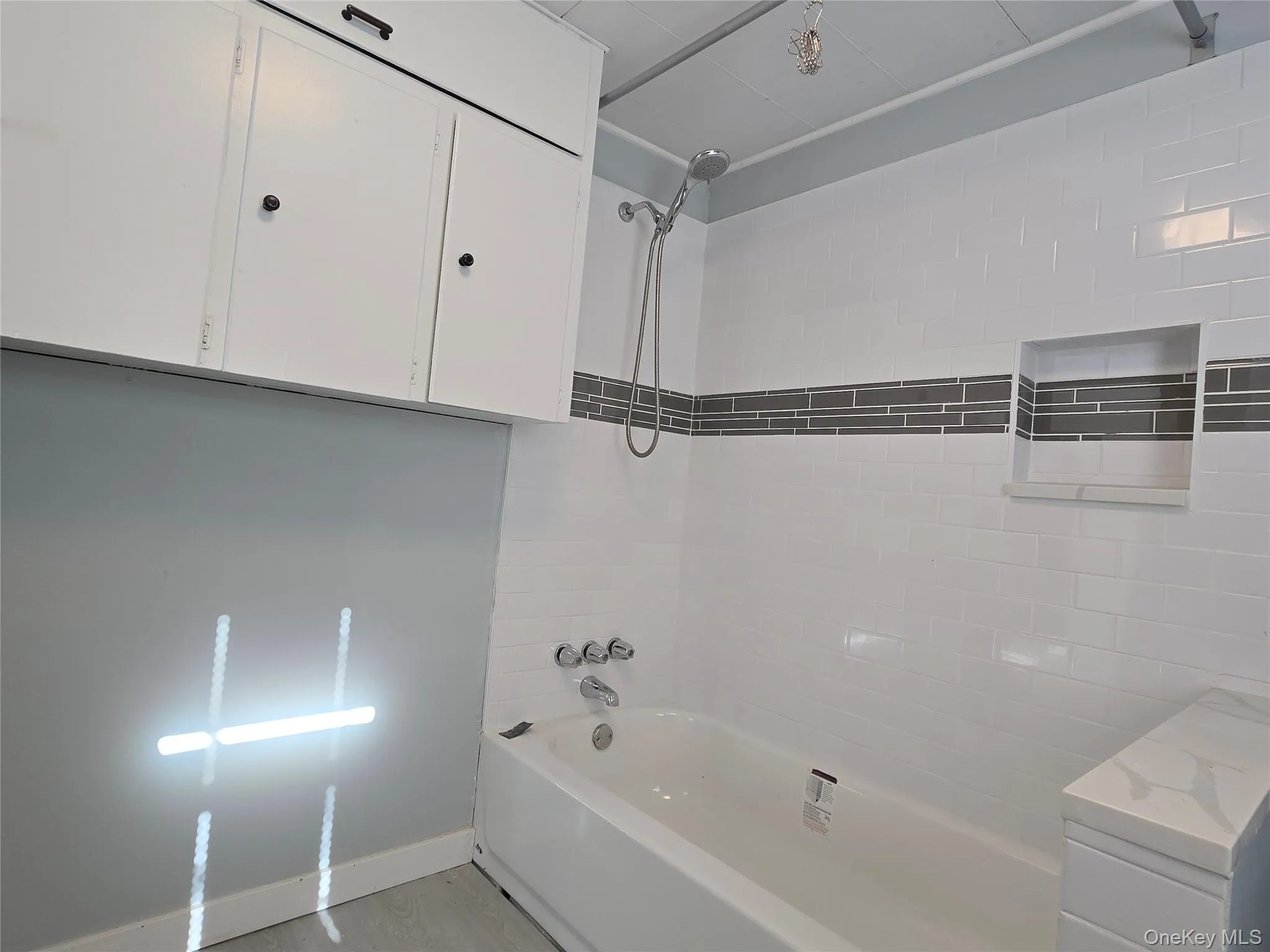 Bathroom with washtub / shower combination and vanity Bathroom with washtub / shower combination and vanity