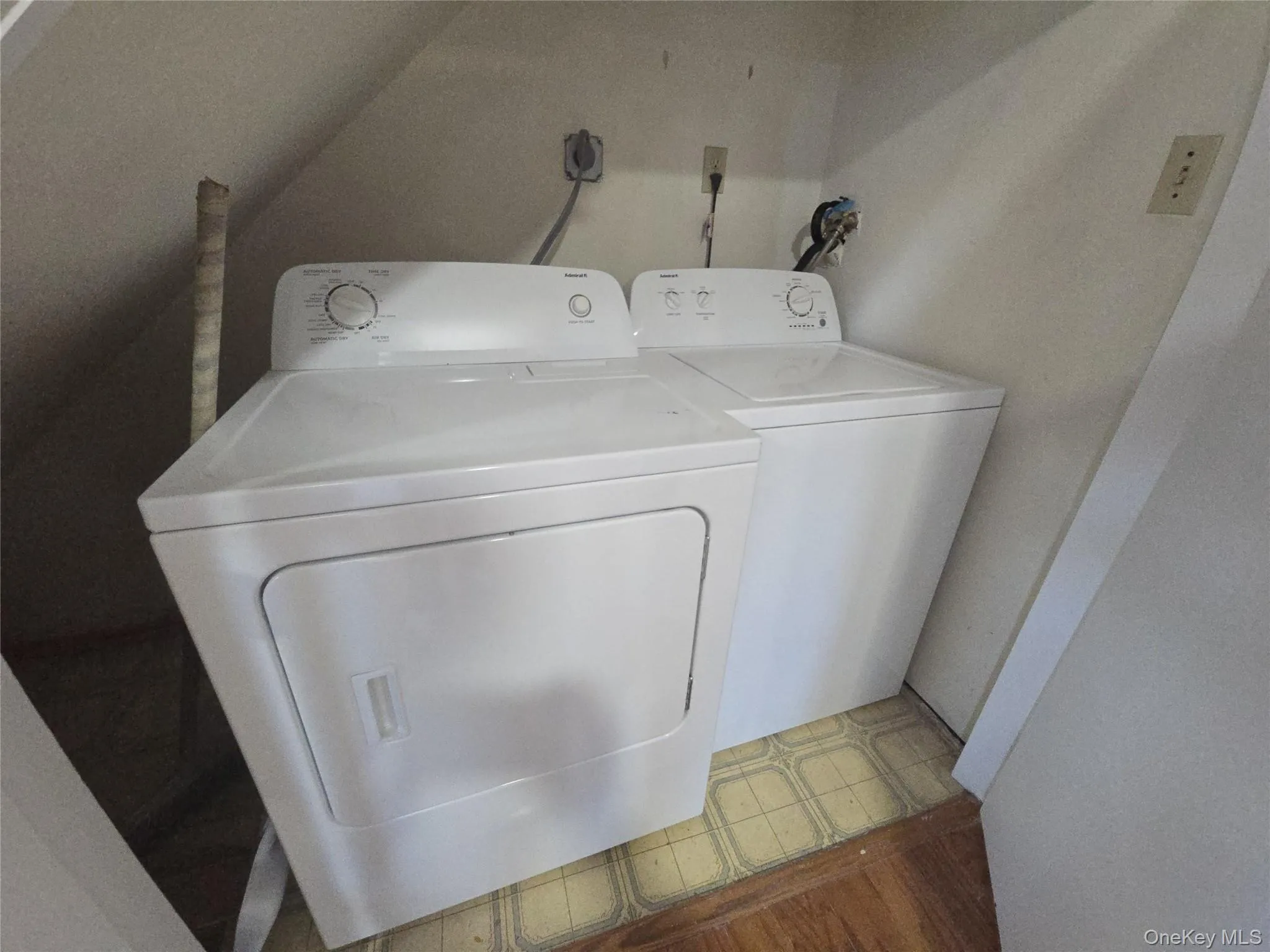 Washroom with washing machine and dryer Washroom with washing machine and dryer