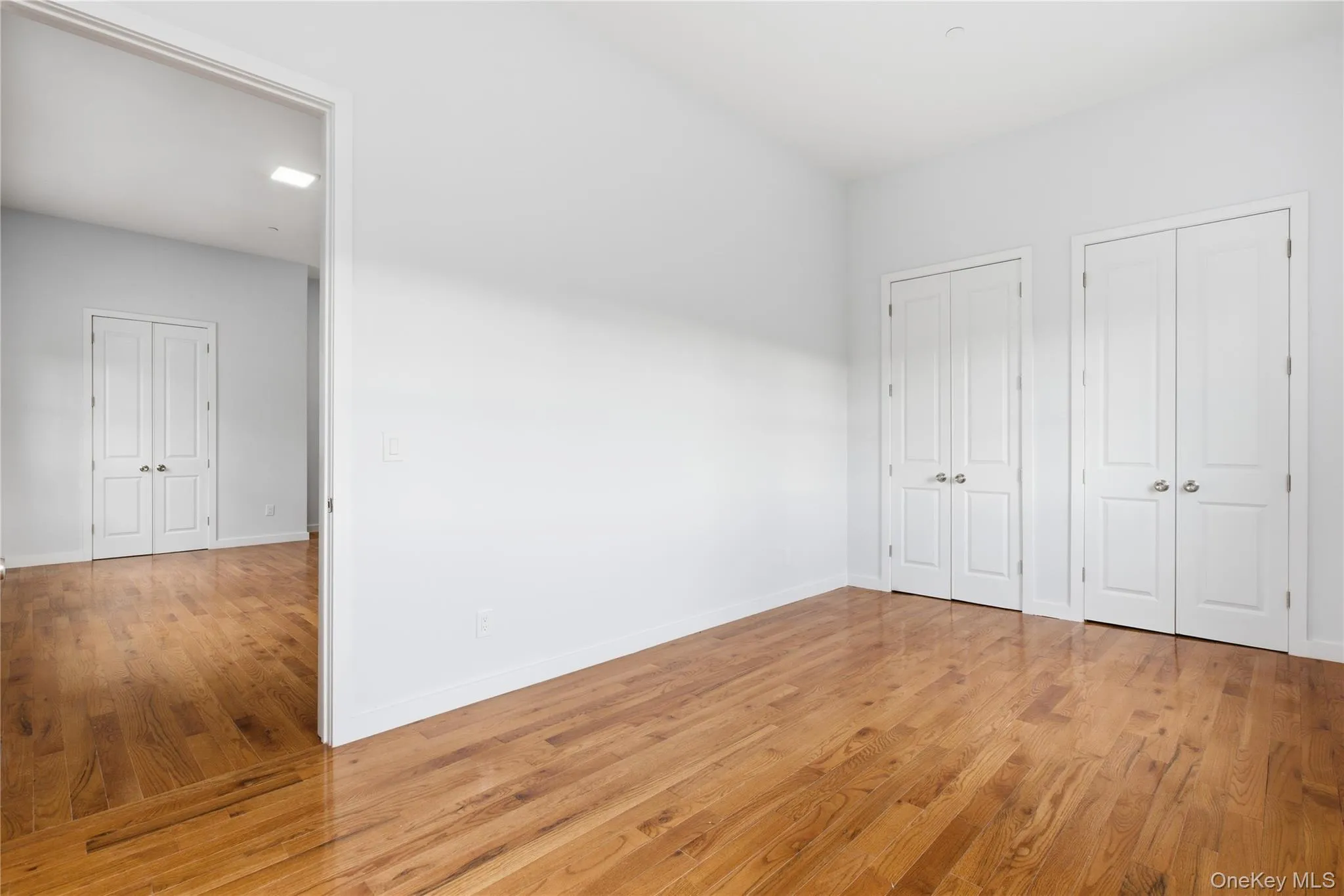 Bedroom featuring 2 closets Bedroom featuring 2 closets