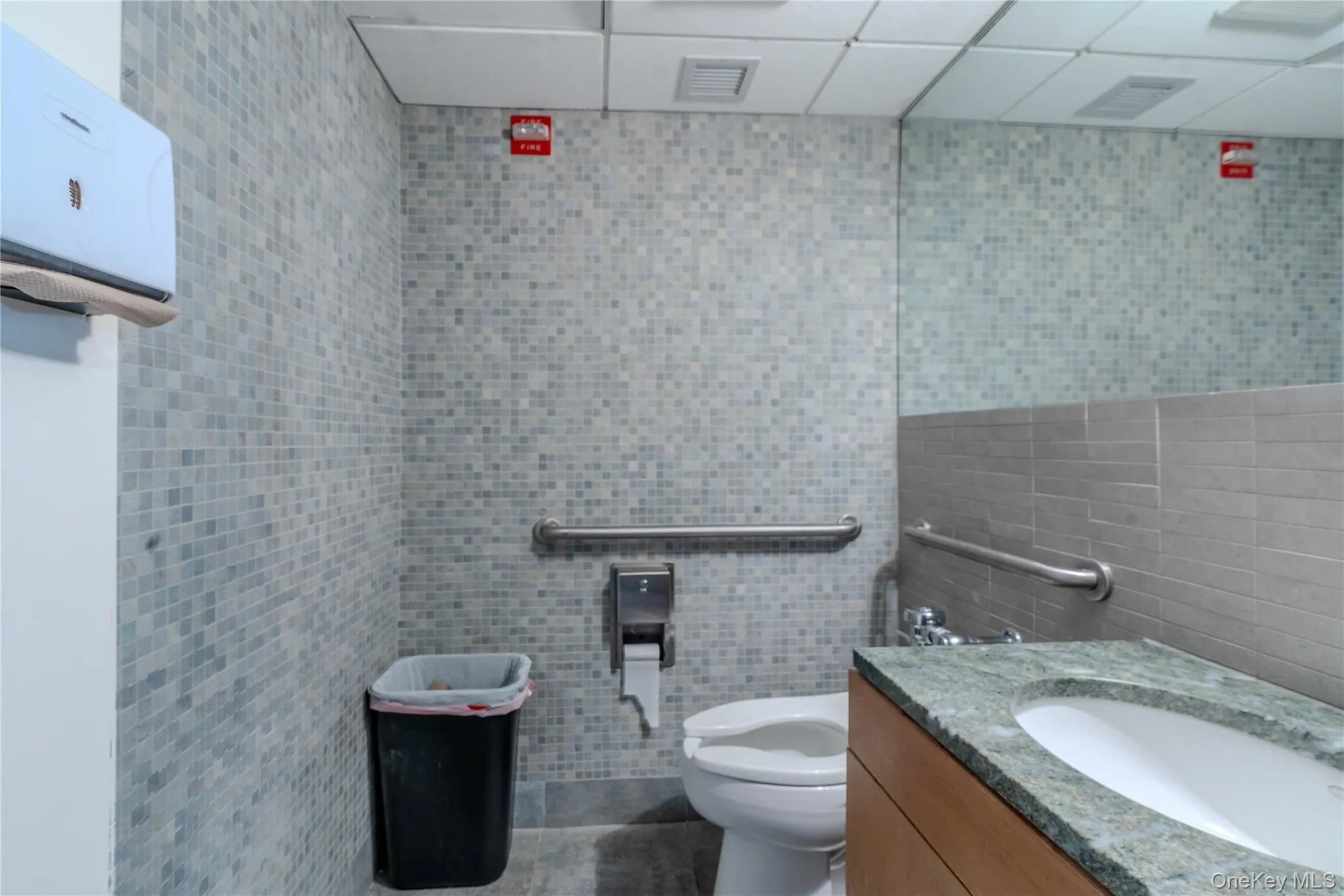 Bathroom with vanity and tile walls Bathroom with vanity and tile walls