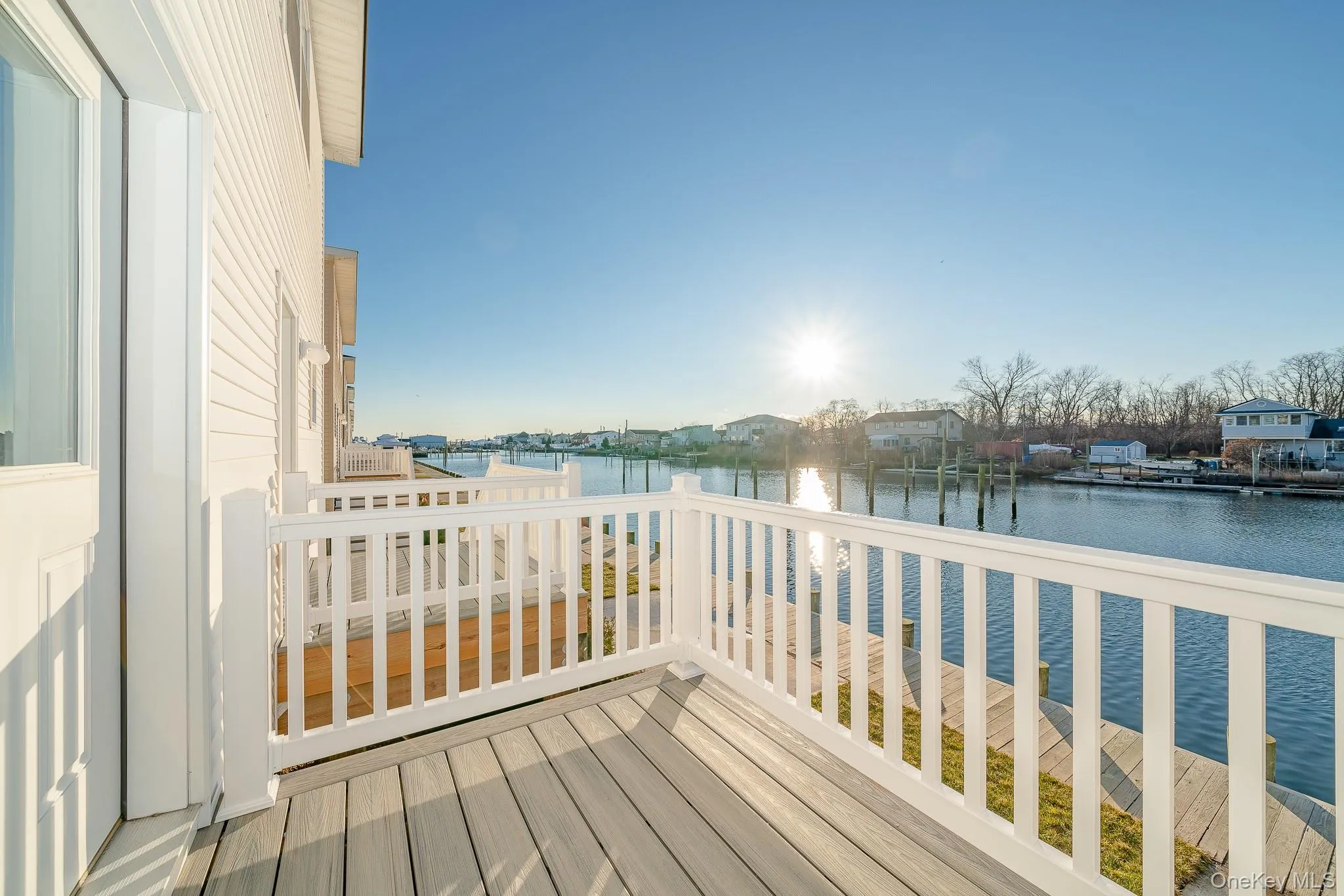 Wooden deck featuring a water view Wooden deck featuring a water view
