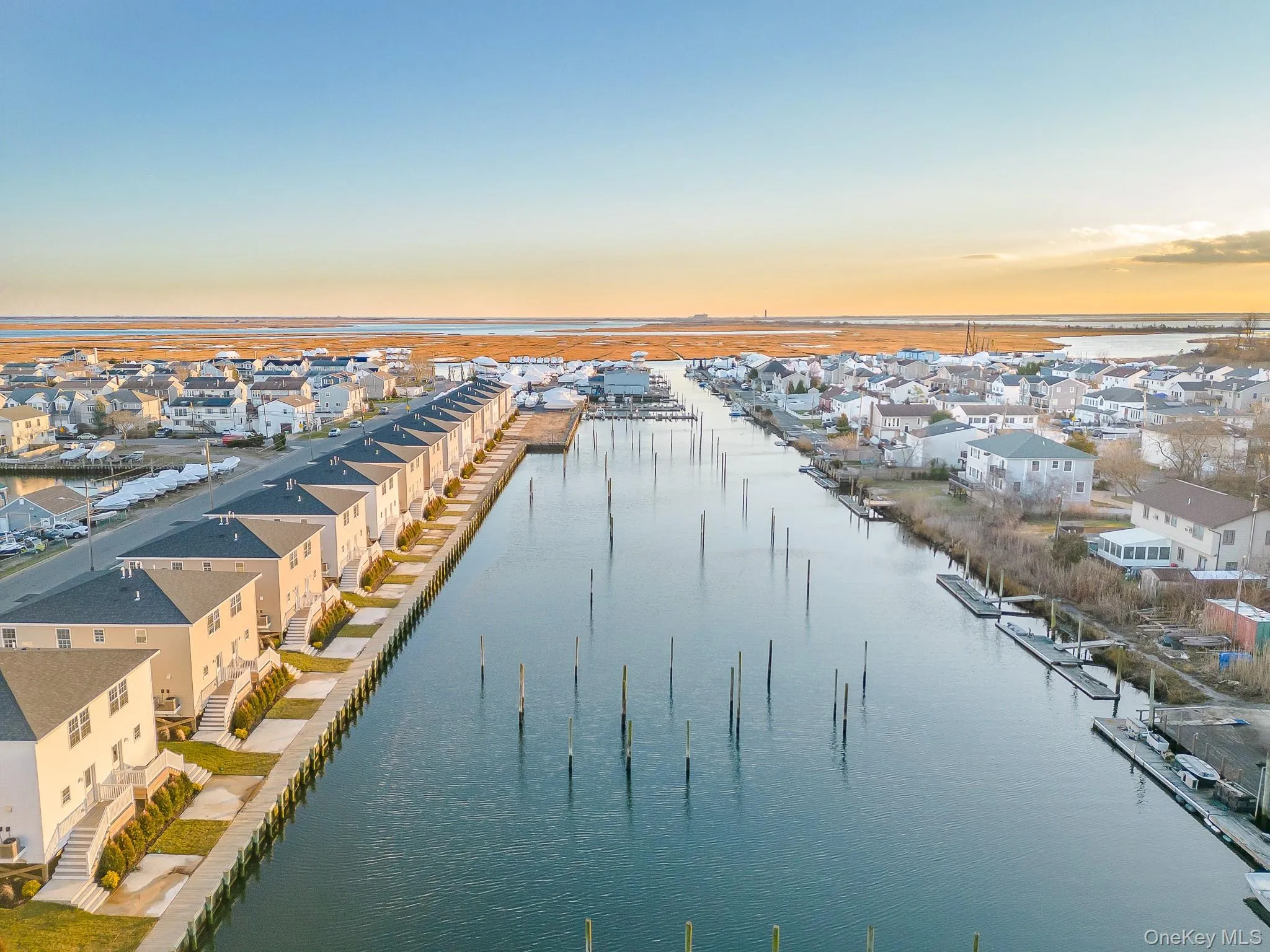 Aerial view of residential area featuring a nearby body of water Aerial view of residential area featuring a nearby body of water