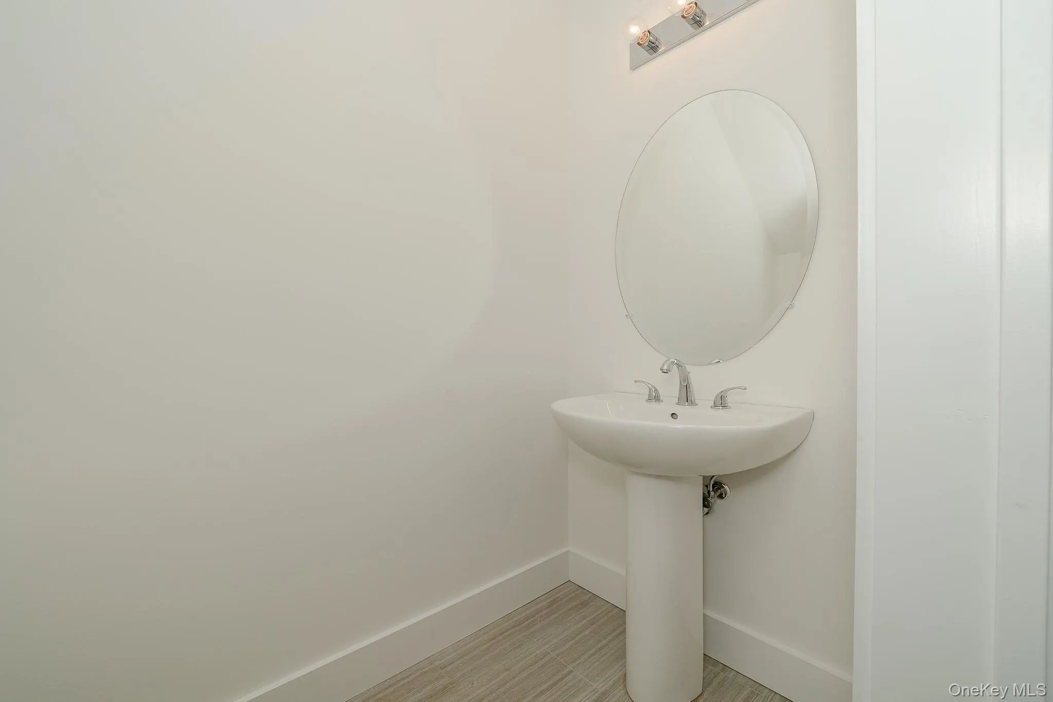 Bathroom featuring baseboards Bathroom featuring baseboards