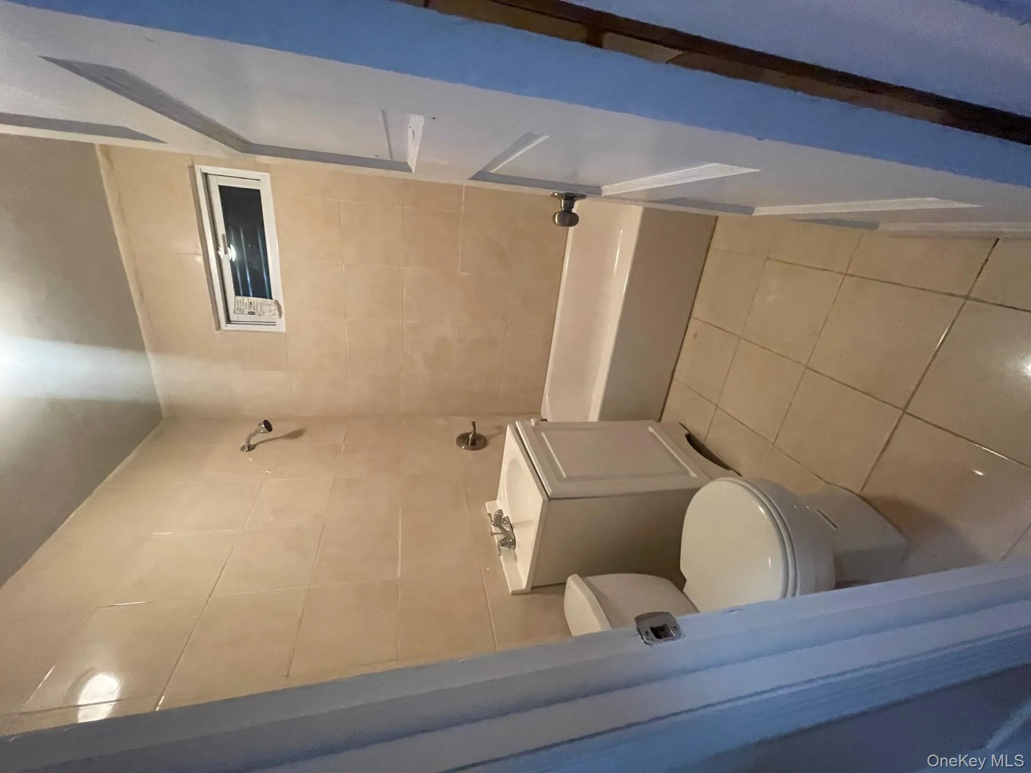 Full bath featuring vanity, light tile patterned floors, and bathtub / shower combination Full bath featuring vanity, light tile patterned floors, and bathtub / shower combination