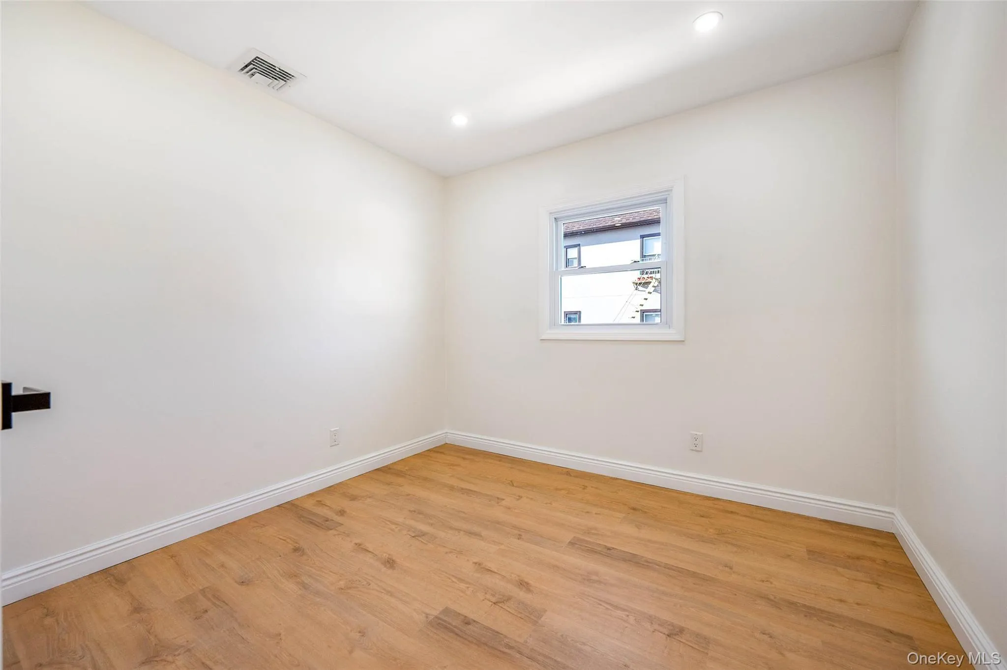 Spare room featuring light wood finished floors and recessed lighting Spare room featuring light wood finished floors and recessed lighting