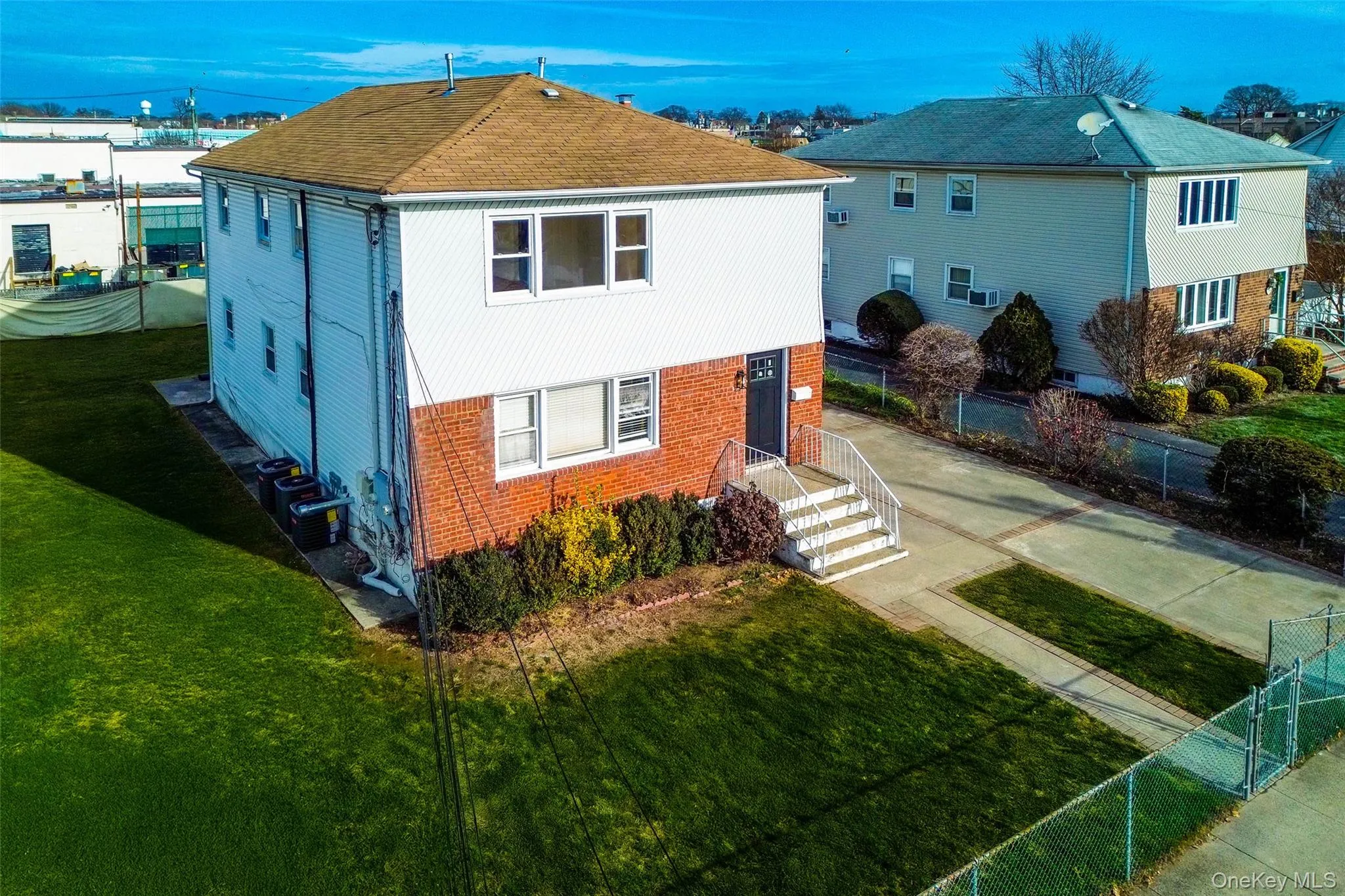 View of front of home featuring brick siding and concrete driveway View of front of home featuring brick siding and concrete driveway