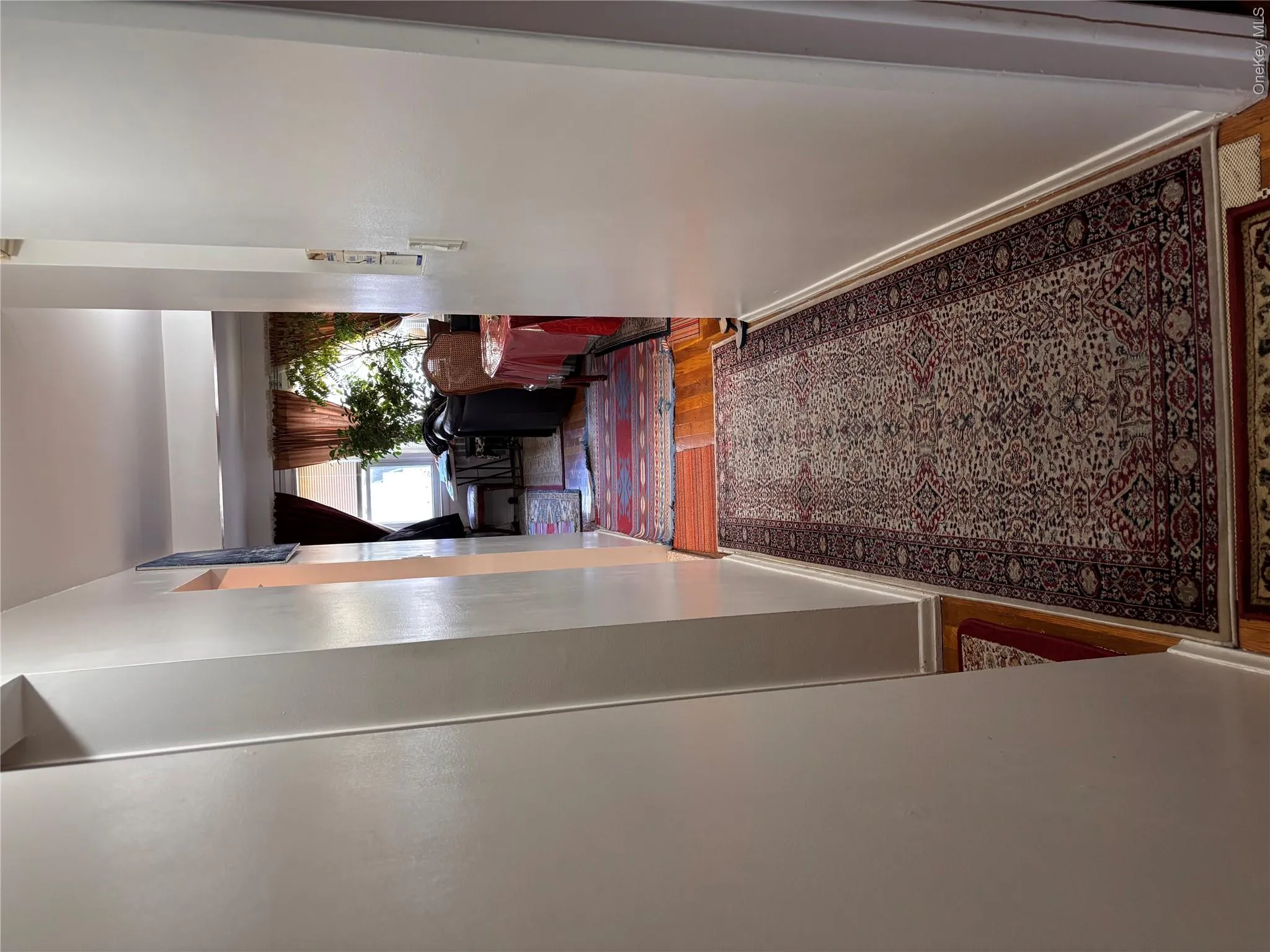 Hallway featuring wood finished floors Hallway featuring wood finished floors