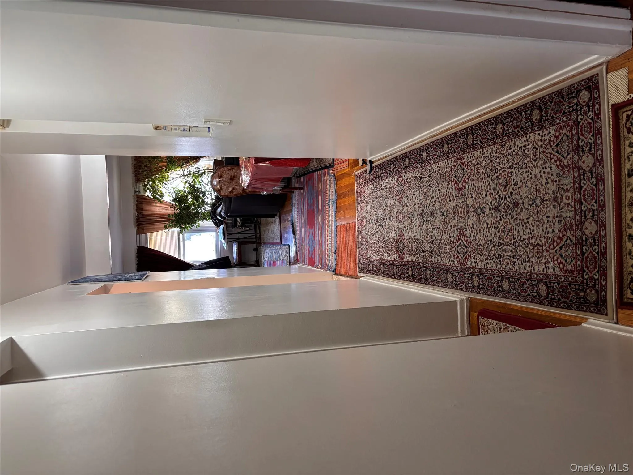 Hallway featuring wood finished floors Hallway featuring wood finished floors