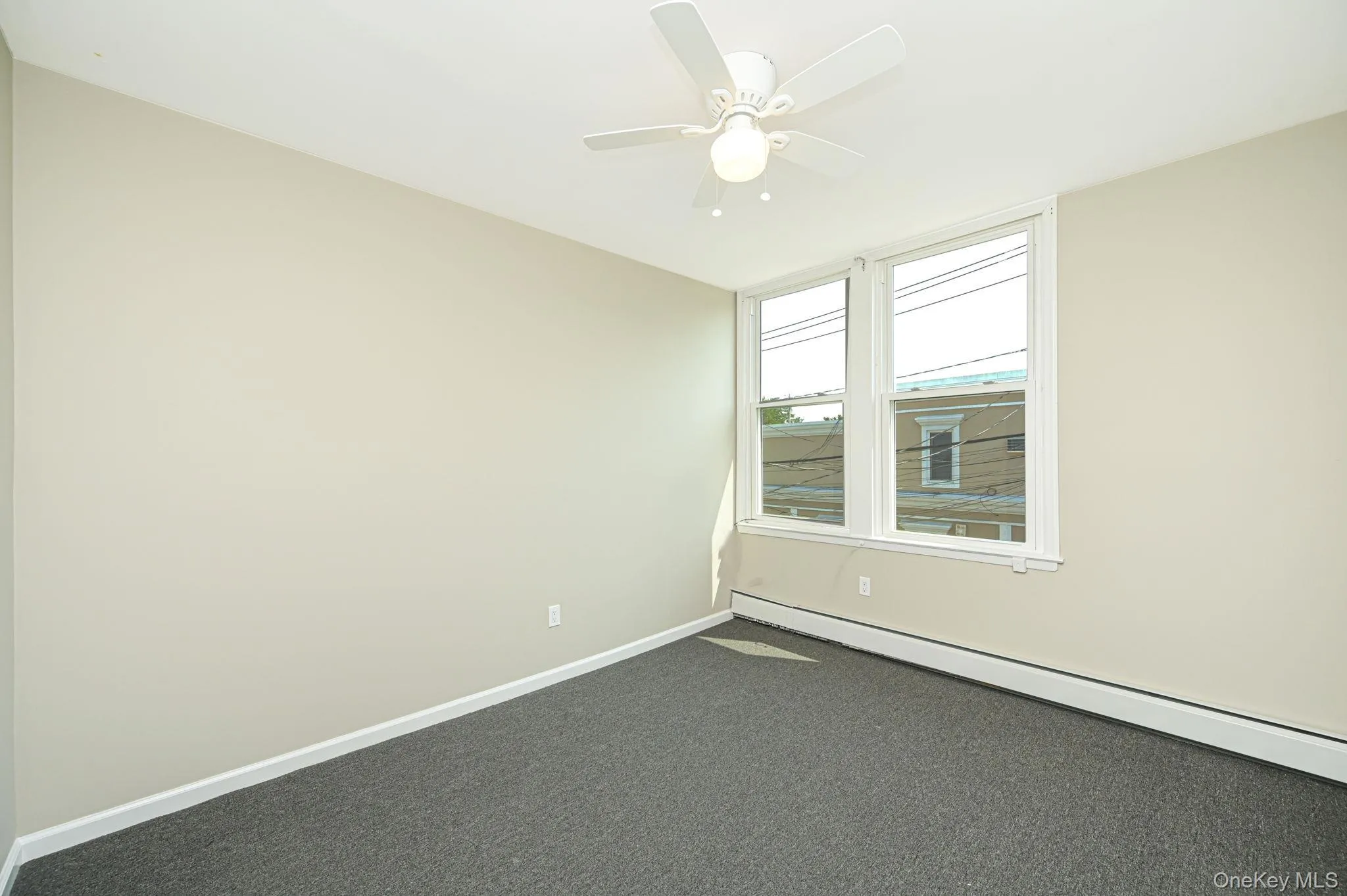 bedroom w/carpet floors and a ceiling fan bedroom w/carpet floors and a ceiling fan