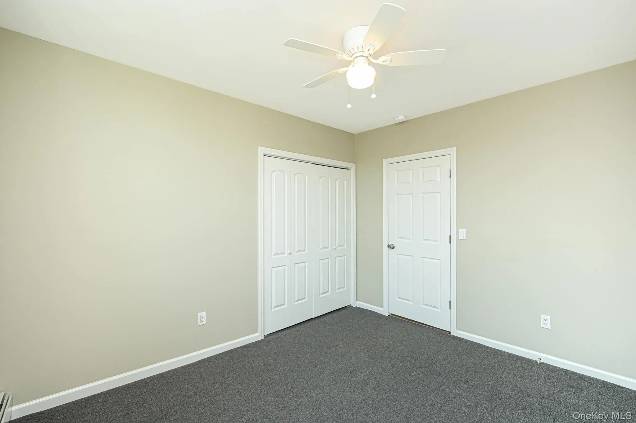 bedroom w/carpet floors and a ceiling fan bedroom w/carpet floors and a ceiling fan