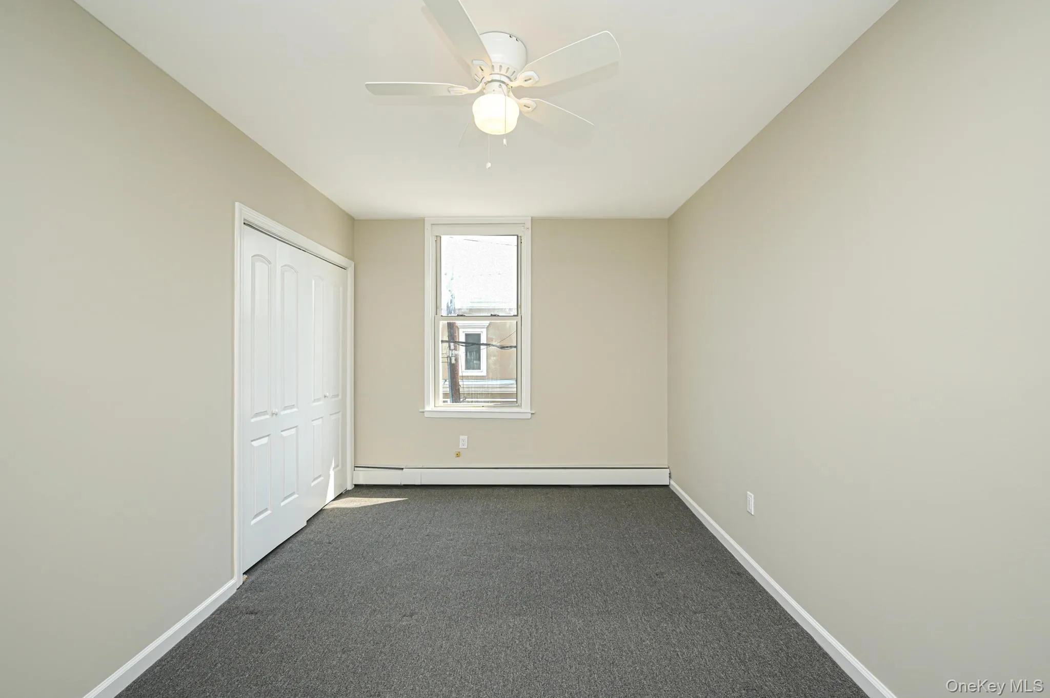 bedroom w/carpet floors and a ceiling fan bedroom w/carpet floors and a ceiling fan