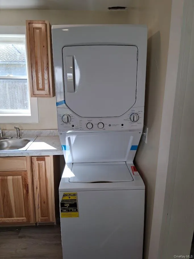 Stacked washing machine and dryer Stacked washing machine and dryer