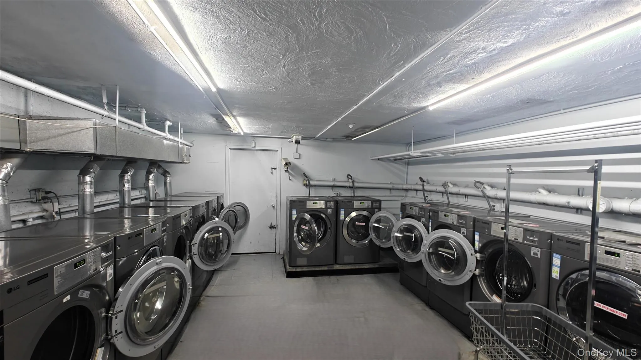 Community laundry room with independent washer and dryer Community laundry room with independent washer and dryer