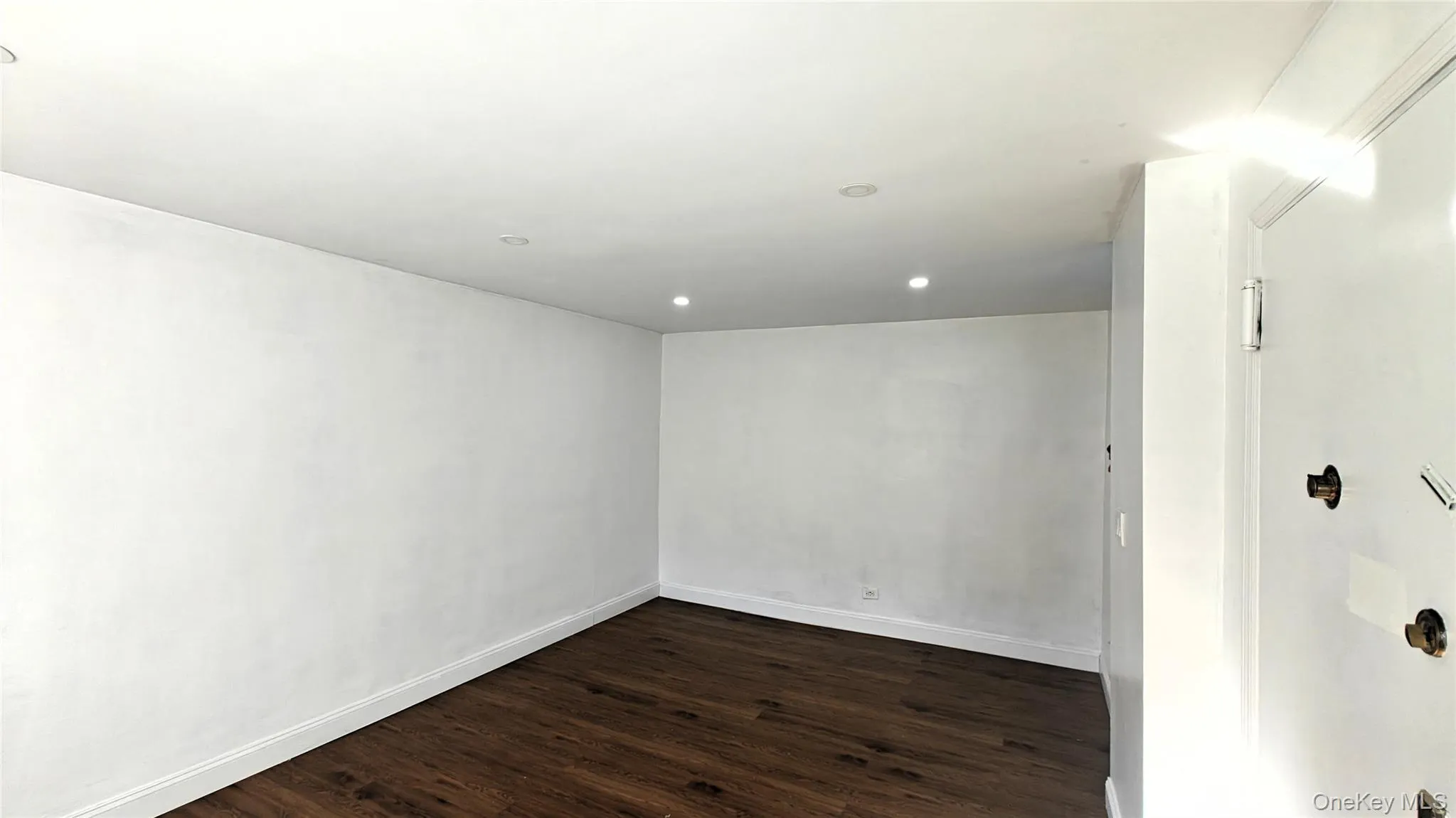 Spare room featuring dark wood-style floors and recessed lighting Spare room featuring dark wood-style floors and recessed lighting