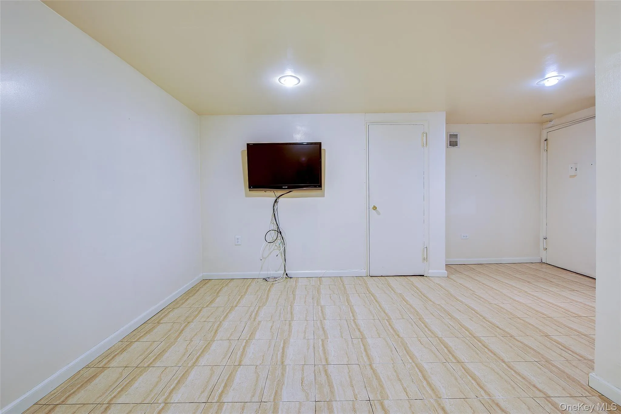 Spare room featuring baseboards Spare room featuring baseboards