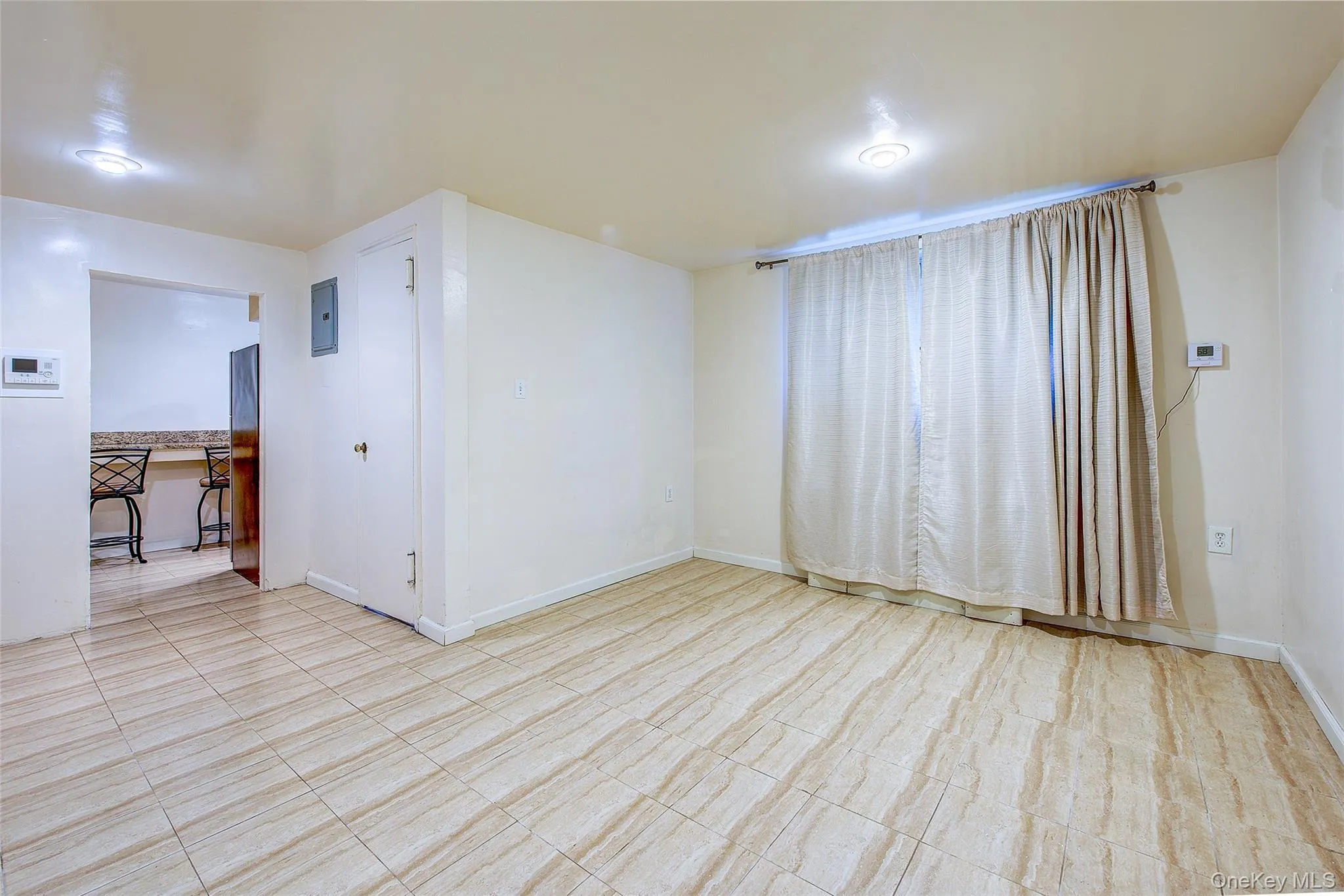 Empty room with baseboards Empty room with baseboards