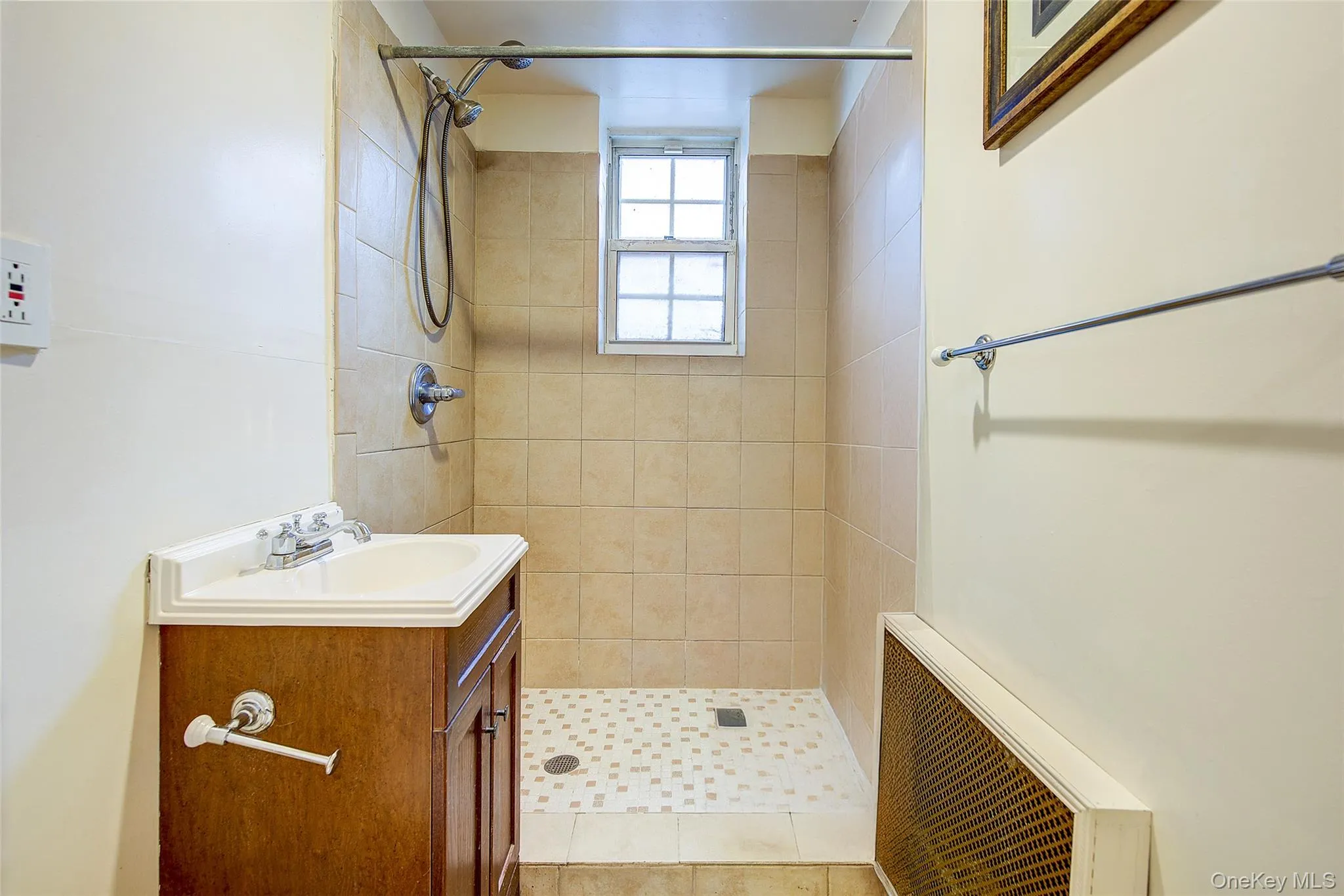 Bathroom with vanity and a stall shower Bathroom with vanity and a stall shower