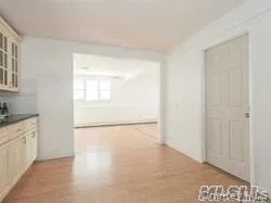 Hallway featuring light wood-style flooring Hallway featuring light wood-style flooring