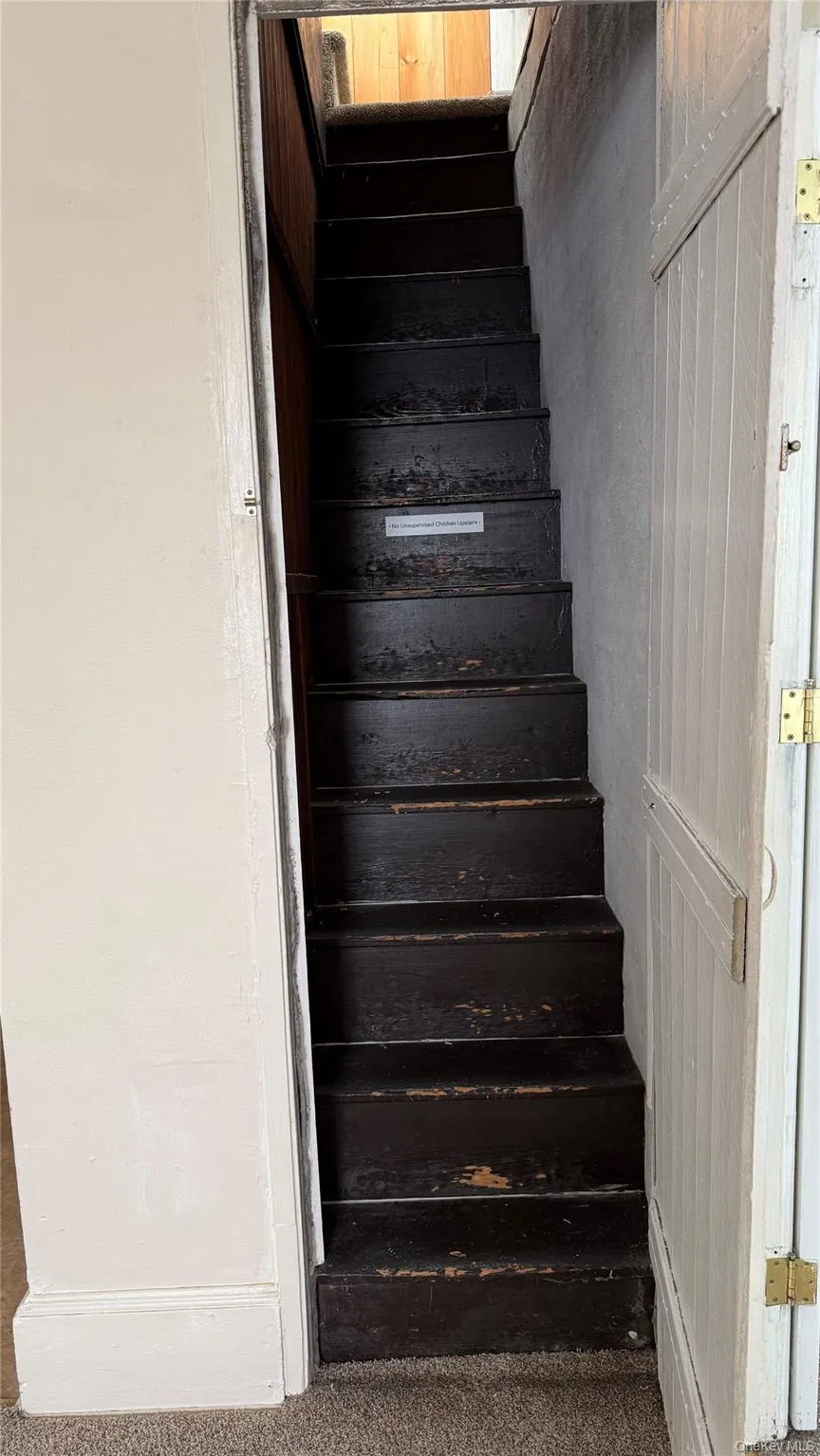 Staircase to Widow's Walk from living room. Staircase to Widow's Walk from living room.